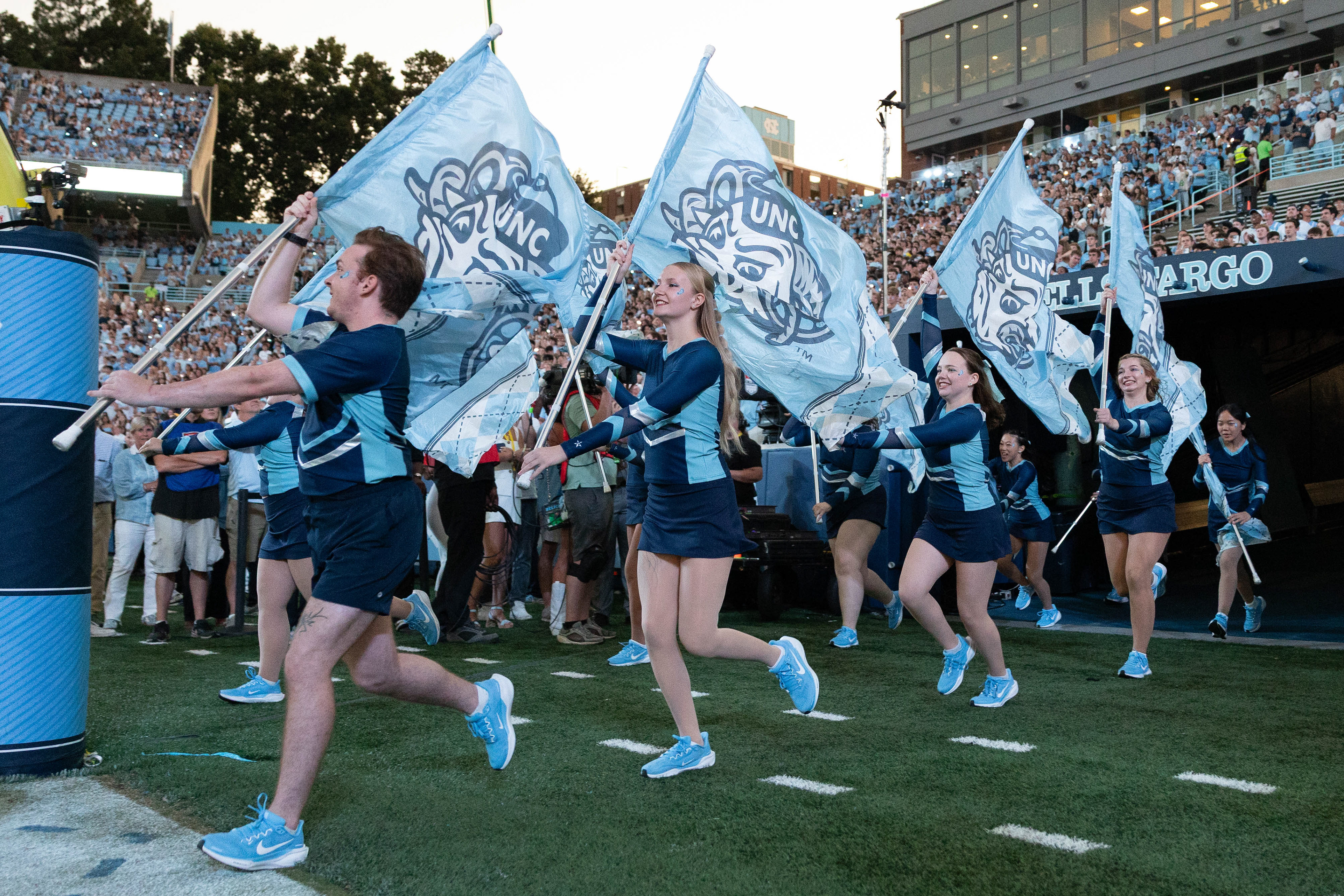 Cheerleaders run out into Kenan Stadium prior to the UNC football game against TCU on Monday, Sept. 1, 2025.