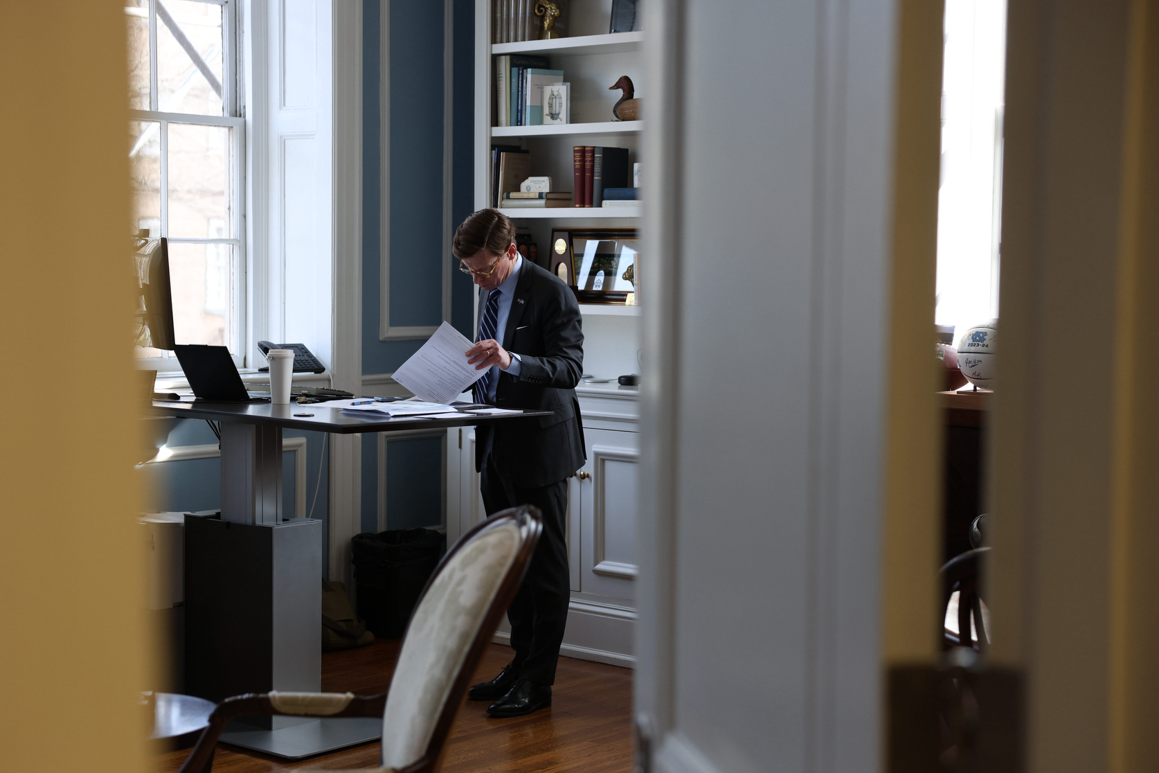 UNC Chancellor Lee Roberts looks through papers in his office at South Building on Wednesday, March 4, 2026. He spent most of his scheduled office time doing paperwork or taking phone calls. 