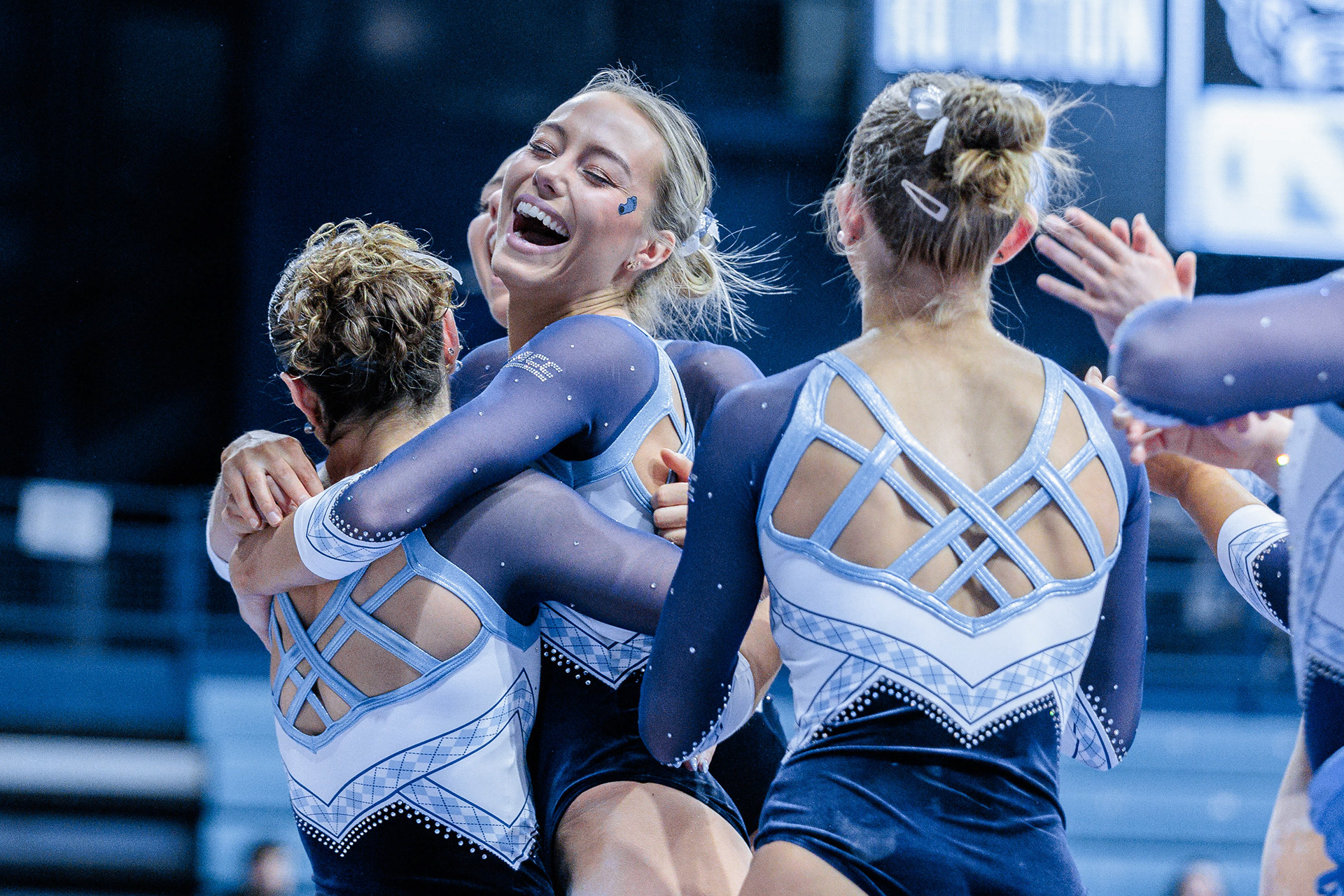 UNC sophomore Neve King celebrates with her teammates during the gymnastics meet against N.C. State at Carmichael Arena on Friday, Jan. 24, 2025. UNC lost 196.350-195.925.