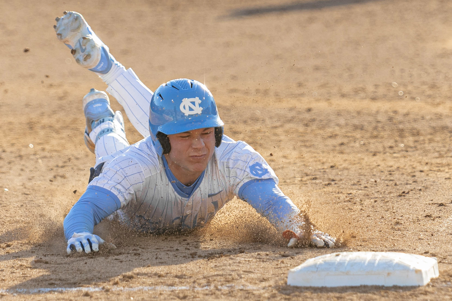 UNC junior outfielder Kane Kepley (27) slides to third base during the baseball game against ECU on Sunday, Feb. 23, 2025 at Boshamer Stadium. UNC won 11-6.