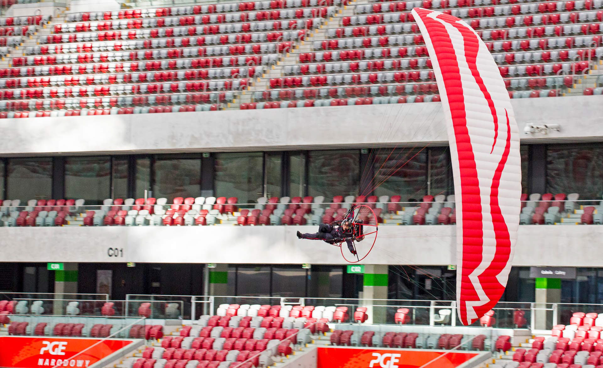 Pawel Lojak Kozarzewski flying inside PGE Narodowy Stadium, Warsaw, Poland.