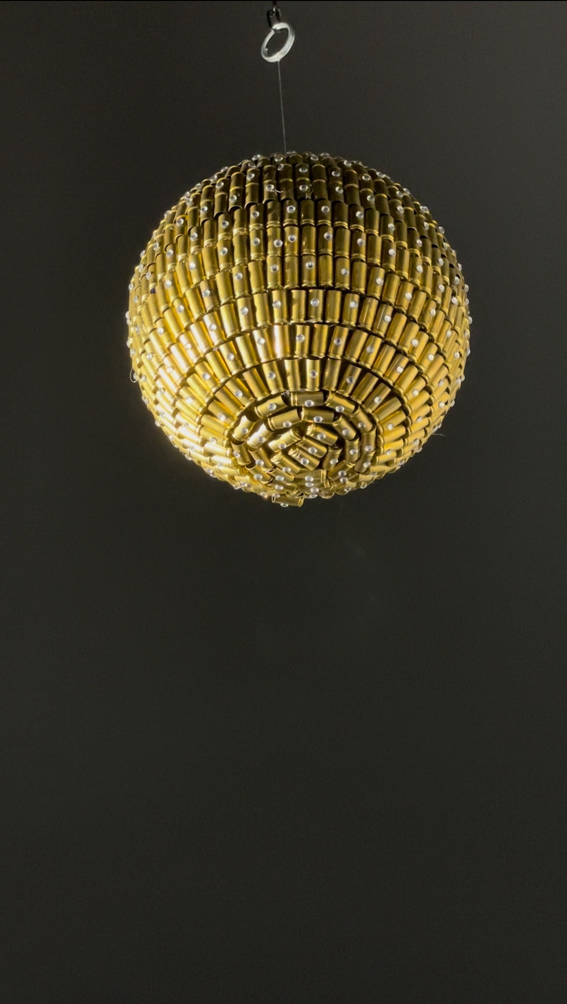 I drew inspiration for my put-in disco sculpture from one of the most current topics at the moment, the war between Russia and Ukraine. The idea for my mix media project was a disco ball made of bullet shells and glitter. In this sculpture, I wanted to combine two opposing poles. Why disco ball?. A disco is a place that triggers some pleasant positive feelings in us, where people like to gather, dance, are relaxed, carefree, etc. Looking at the bullet shells, we immediately get an association with death, a weapon of war, suffering. However, when the bullet shells are presented as part of a disco ball, they lose their original purpose and shine in a completely different light. The sphere forms a kind of monument to all the civilian victims that are the result of war and reminds us of its banality. It is a kind of ready made. The work represents an aesthetic provocation. I also played with the title of the work, which has a double meaning. I took my example from the work of Marcel Duchamp-Fontan.