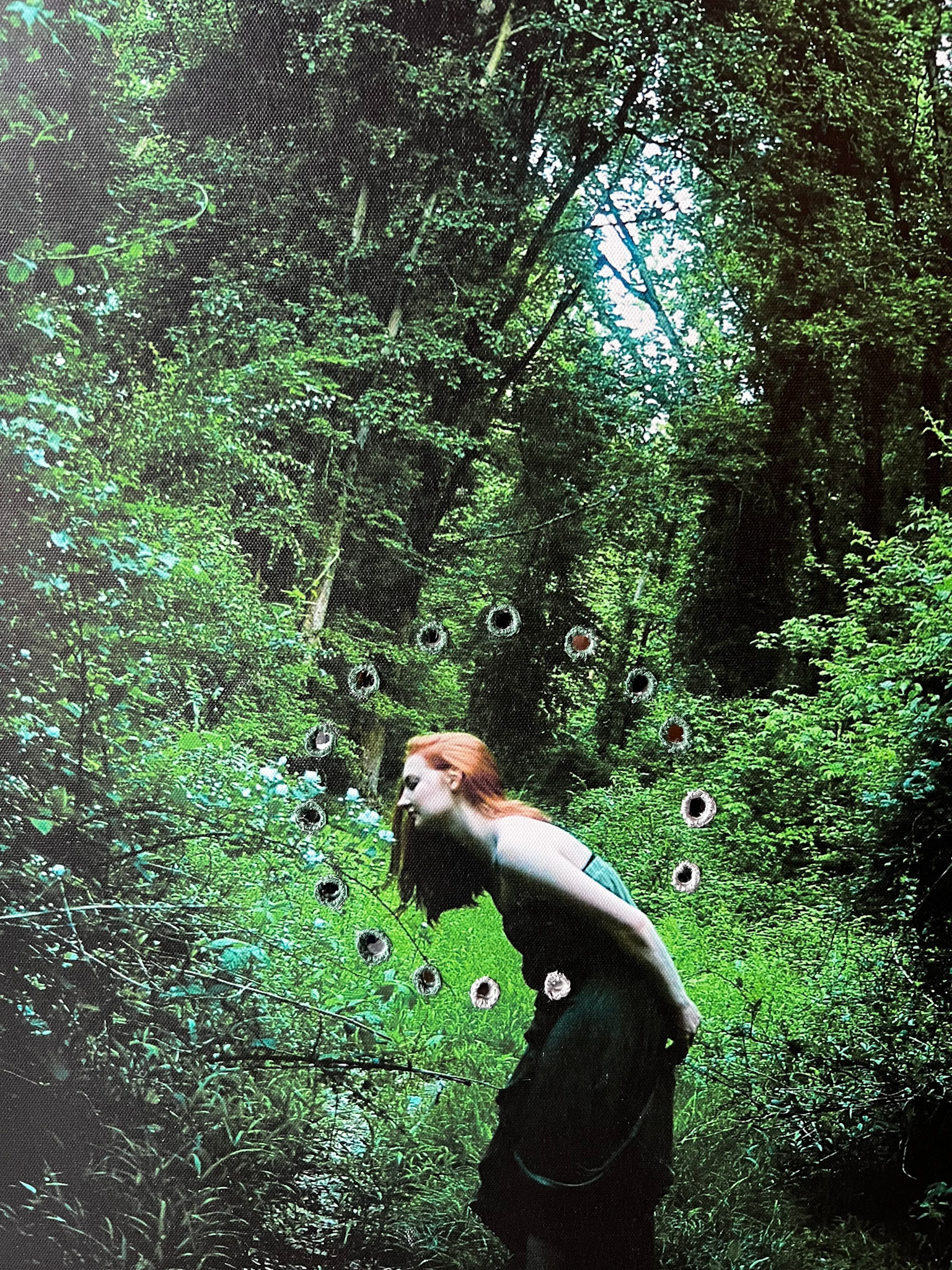 Spring Faerie NFS 16x20x1 (2023) Multimedia A woman stands in the middle of a flourishing forest. She is surrounded by green life and embroidered mirrors.
