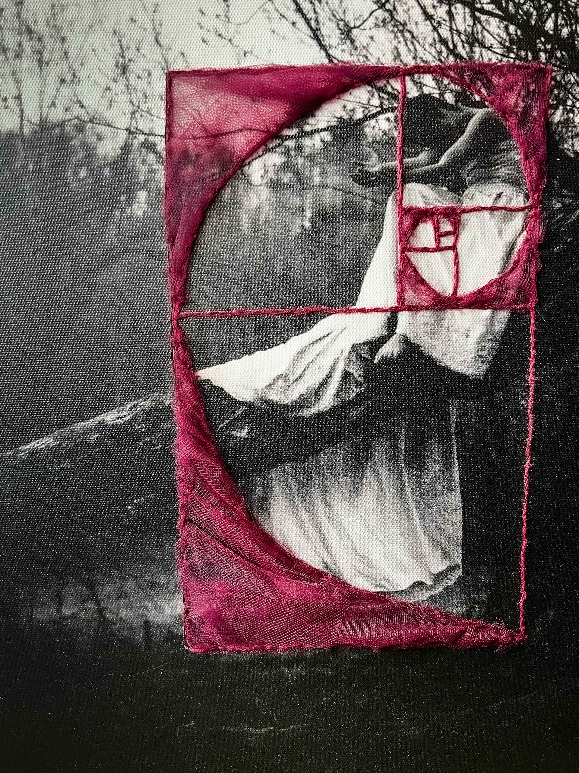 In the Branches of the Dirty South $770 11x14x1 (2023) Multimedia A person sits in a white dress in a sycamore tree. The golden ratio is embroidered over them. Sometimes sadness falls into a perfect balance.