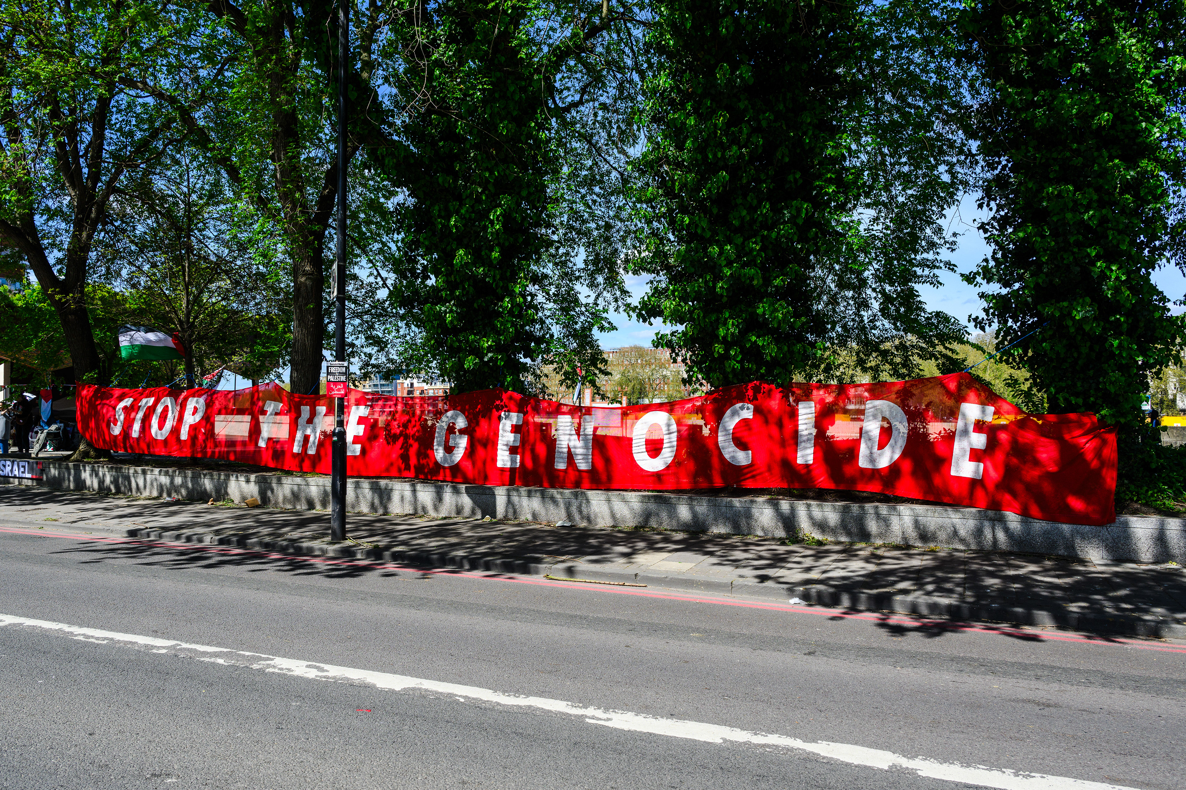A banner was gifted to the camp on the first day of the protest outside the US Embassy in London. The banner, reading " Stop the genocide," is exactly inline with the aims of the protest camp
