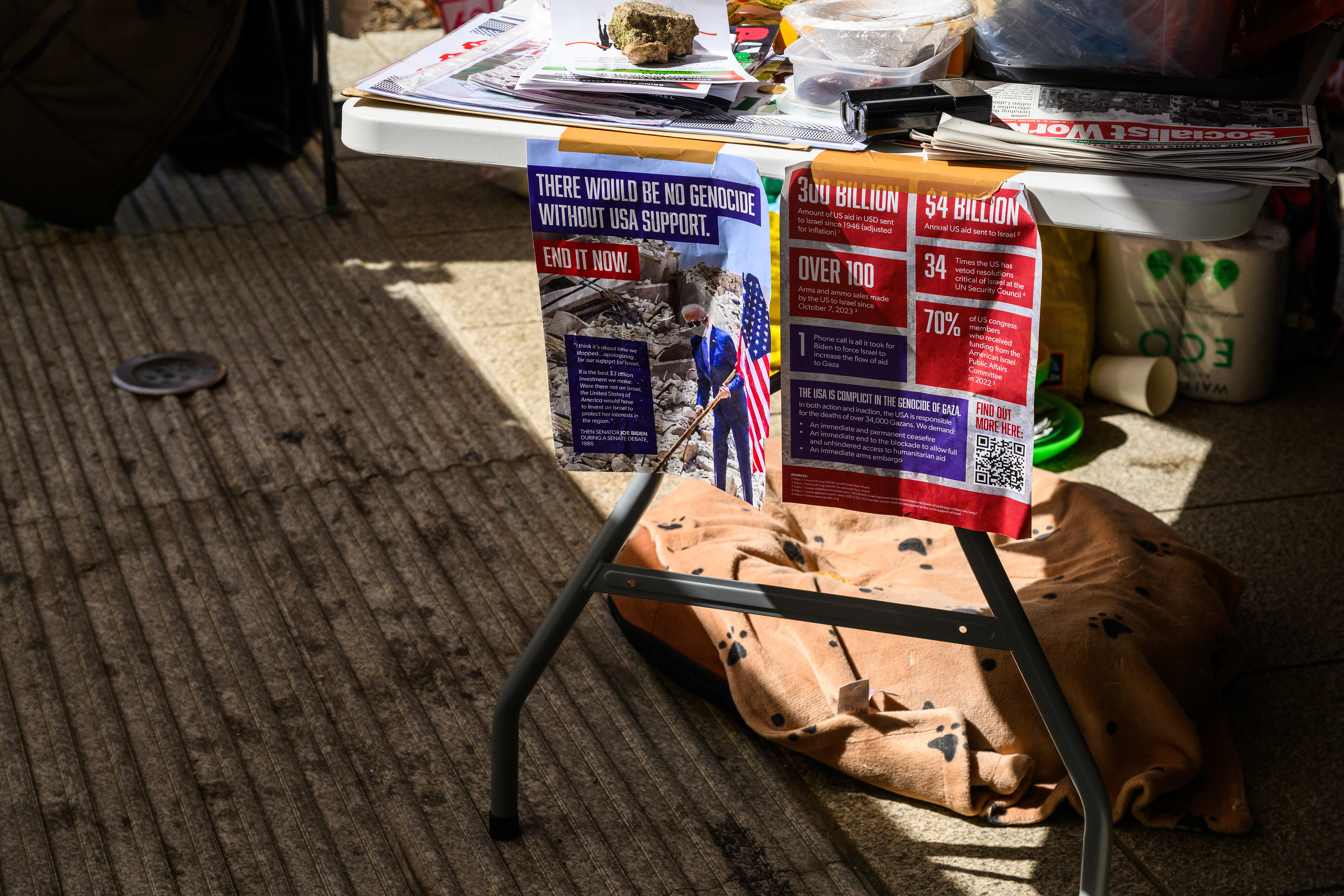 The makeshift kitchen used by the protest camp includes hanging reading materials abot the USA's involment in the Israel/Palestine conflict