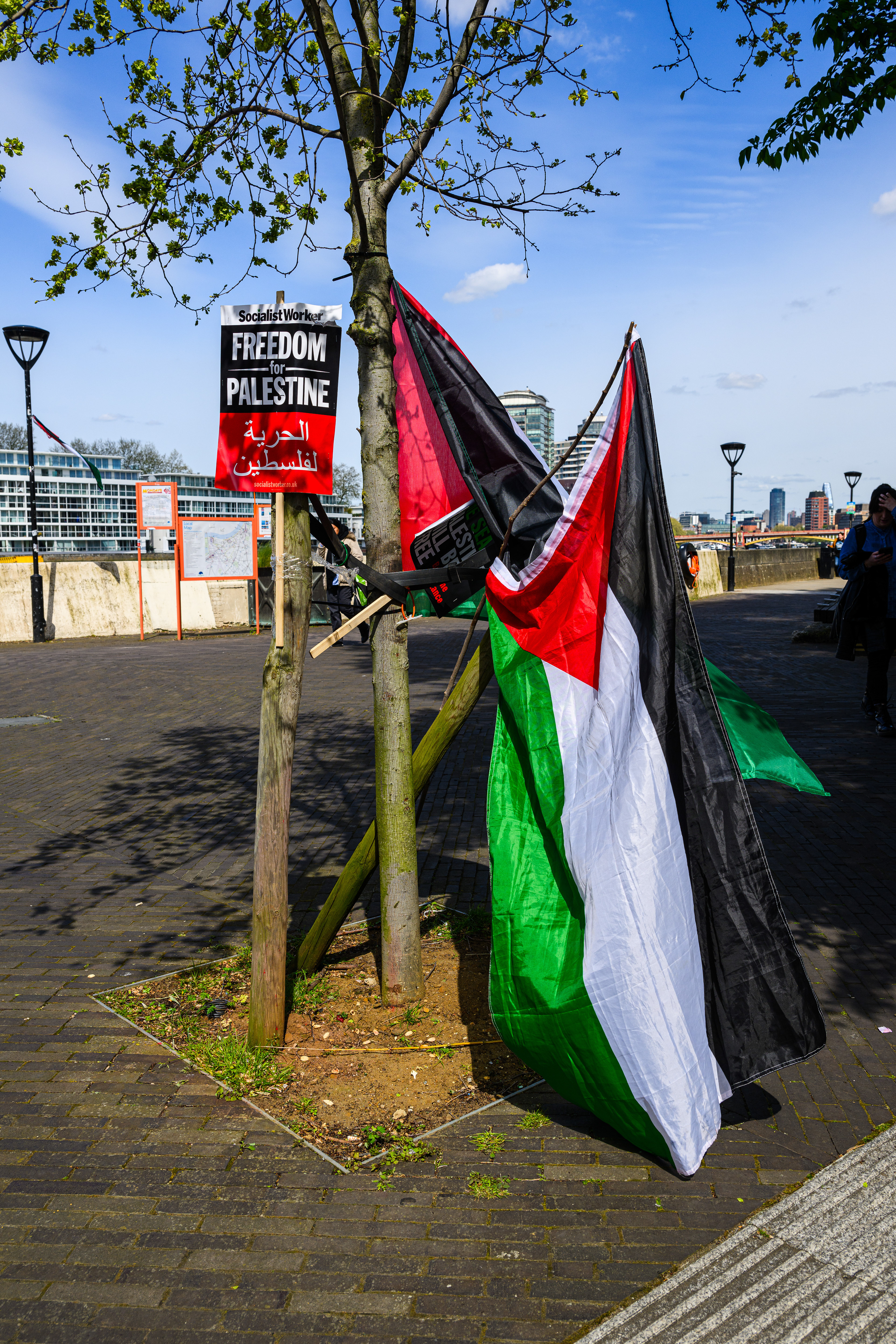 The camps inhabitants have taken advantage of every available place to hang placards and flags.