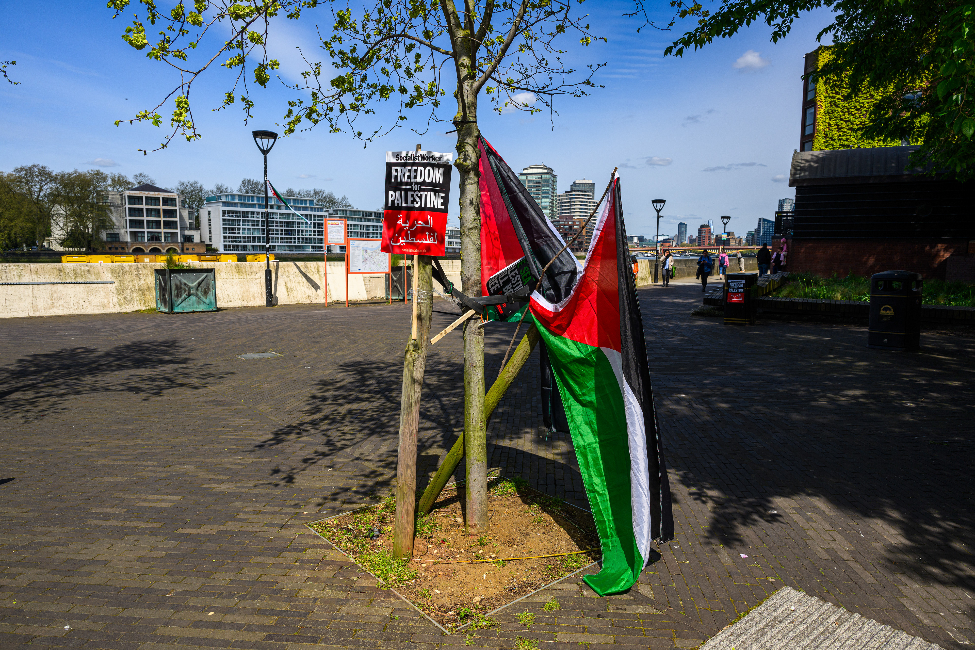 The camps inhabitants have taken advantage of every available place to hang placards and flags.