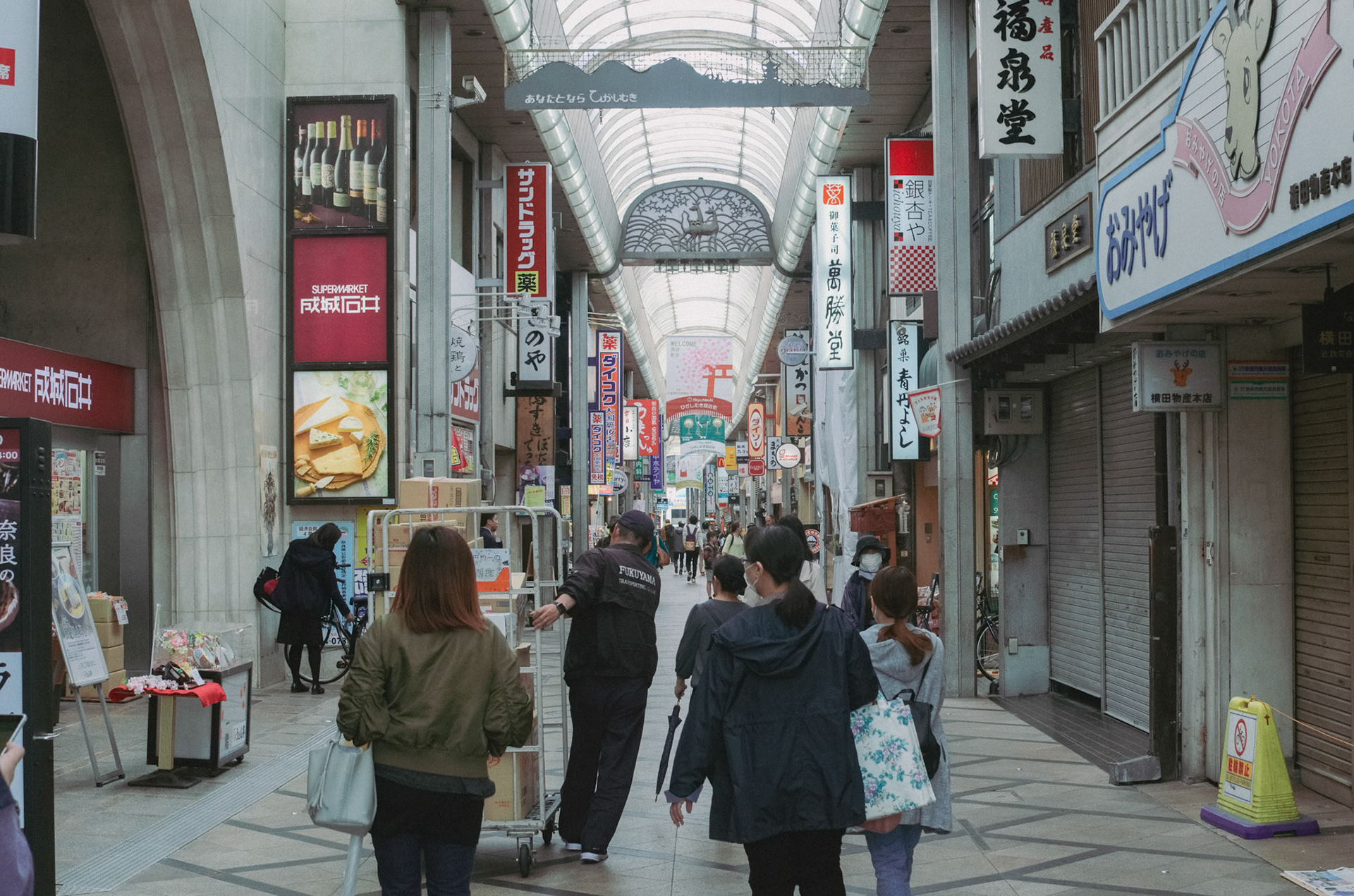 Higashimuki Shopping Street, Nara, Japan  Early morning breakfast hunting at Higashimuki Shopping Street. Most shops are still closed, and locals are busy opening up for the day. There’s something so peaceful about Nara before the crowds arrive (plus, the deer are less aggressive in the early morning!)”