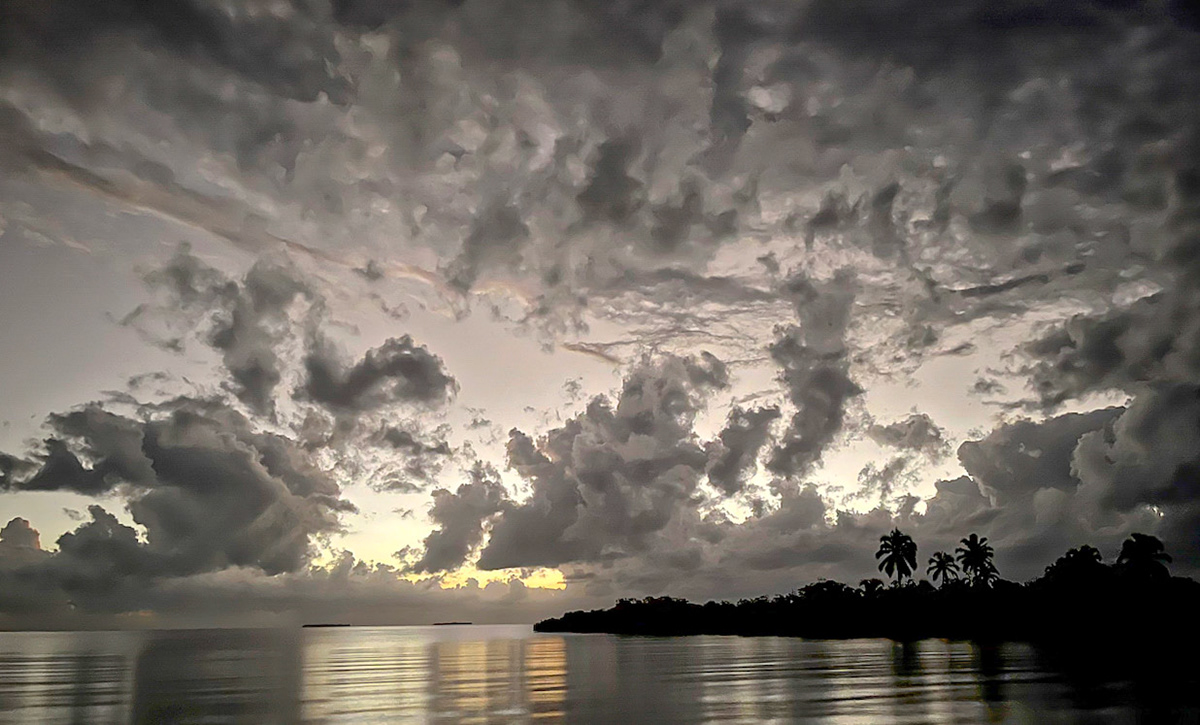 Sunrise from the dock as Carol &amp; Sooney prepare to bird the "mainland."