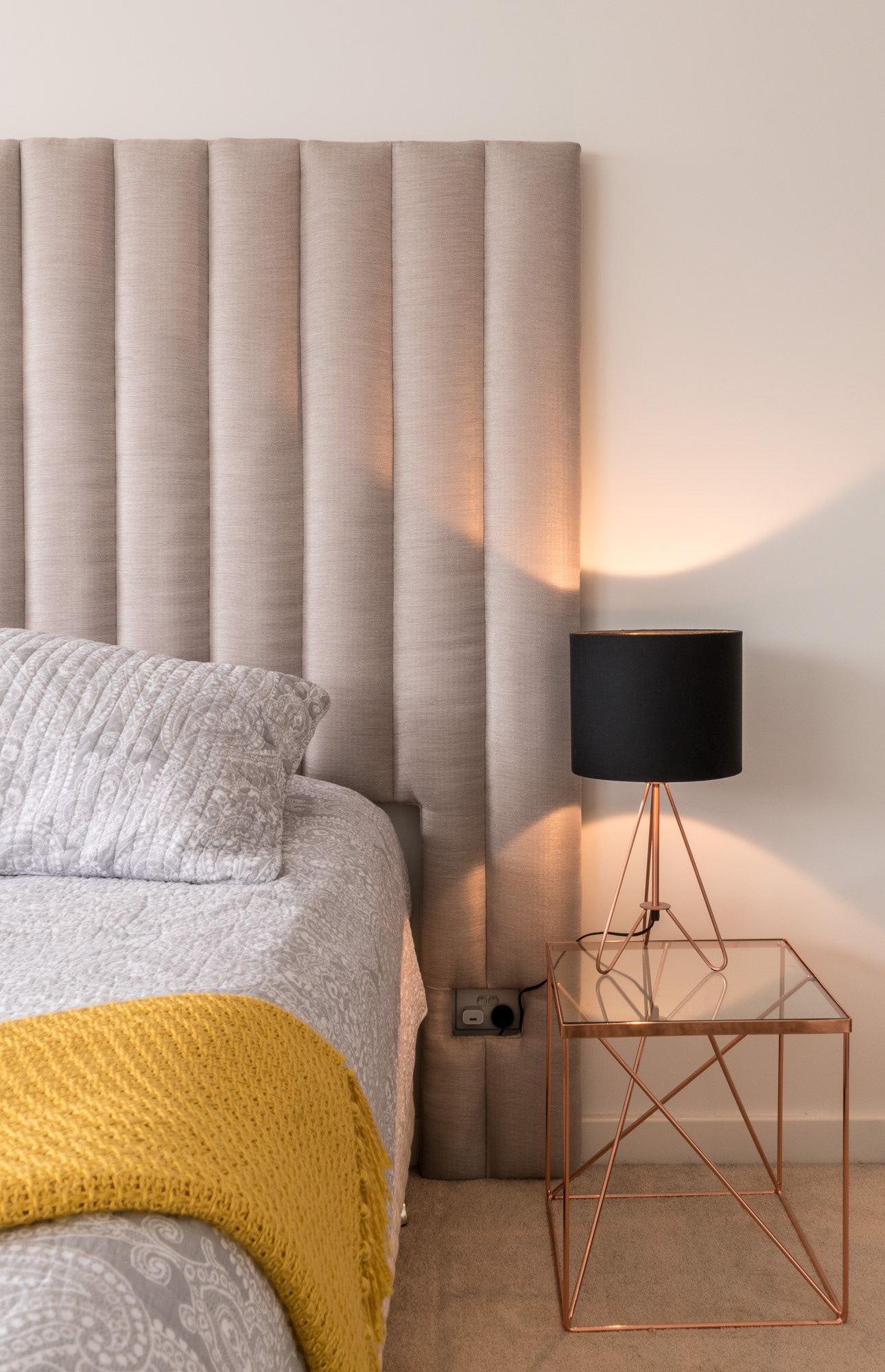 Customised bedhead has cutouts for power points