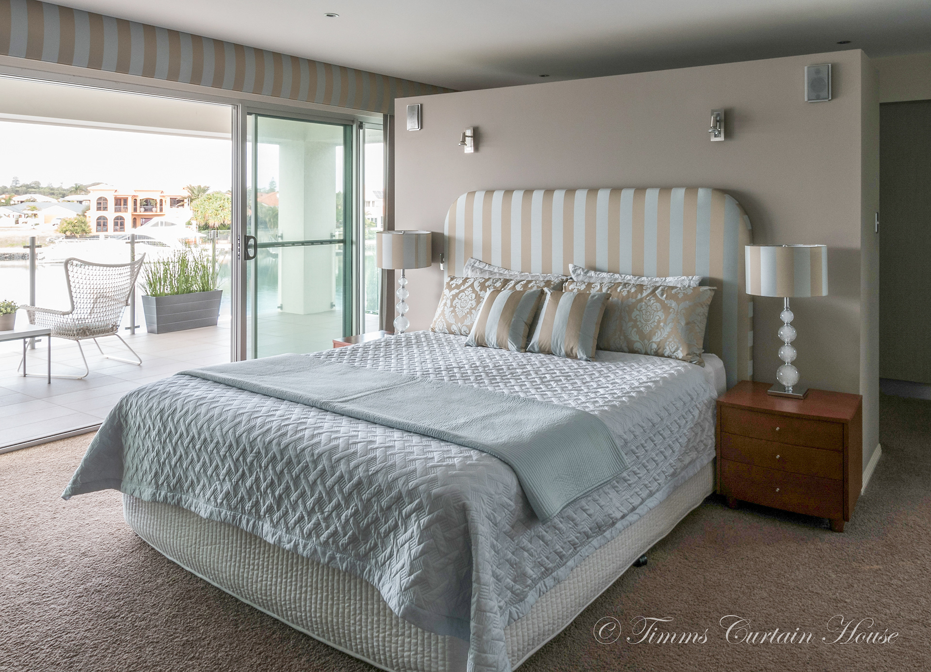 Bedhead, lampshade, cushions and pillowcases all in complimentary fabrics
