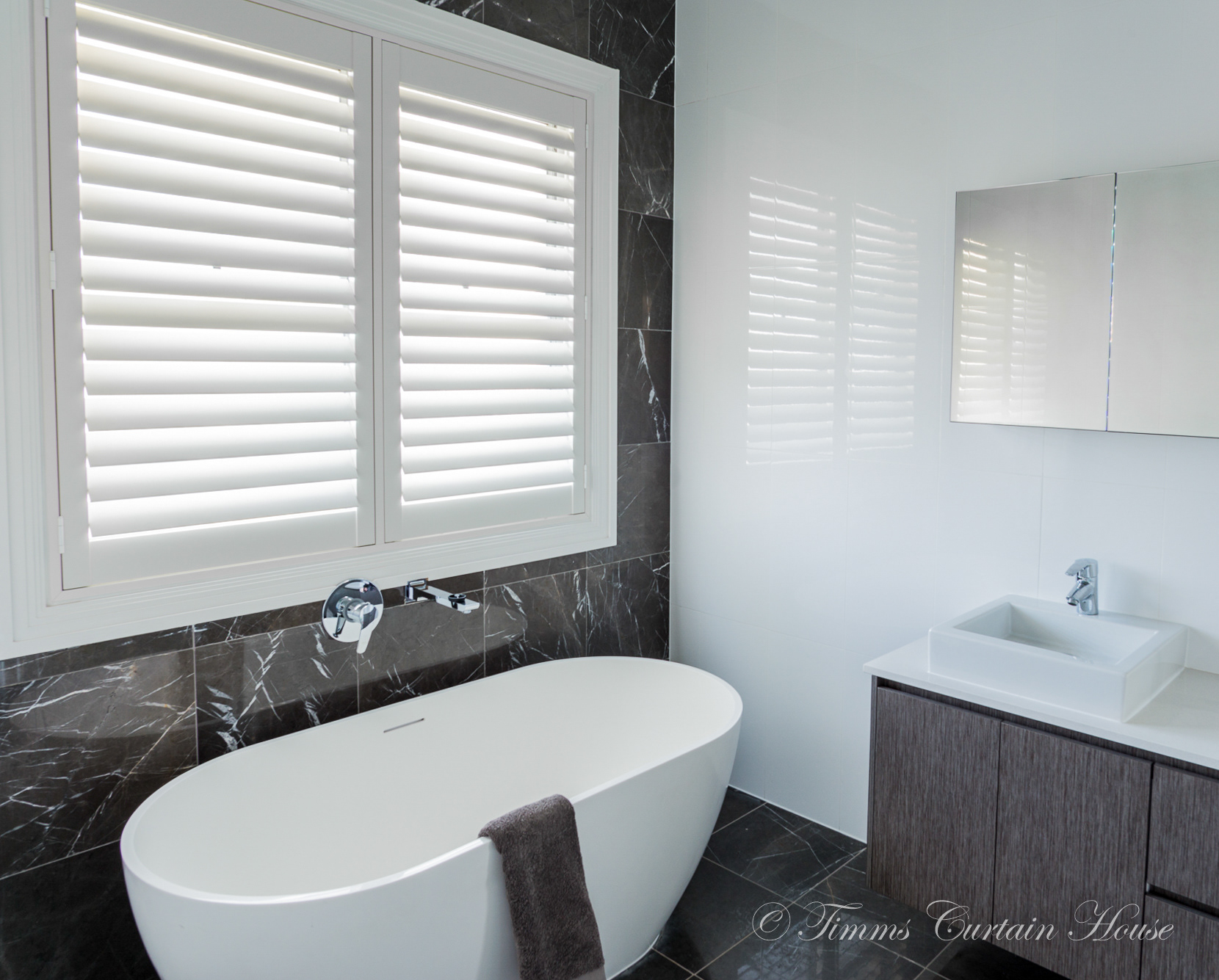 Shutters above splash zone of bath
