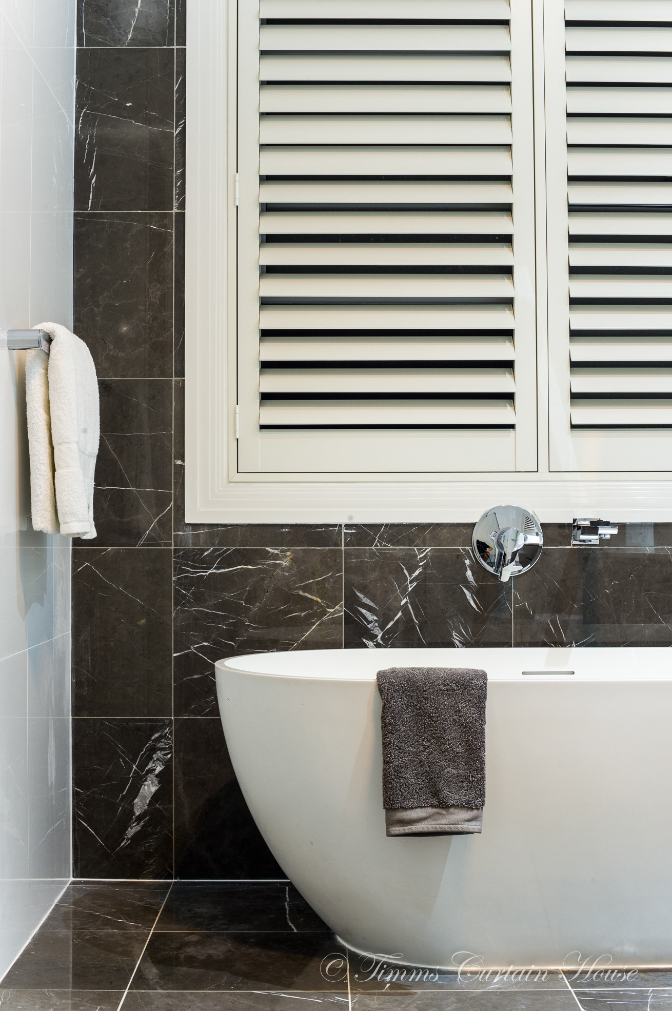 Shutters above splash zone of bath