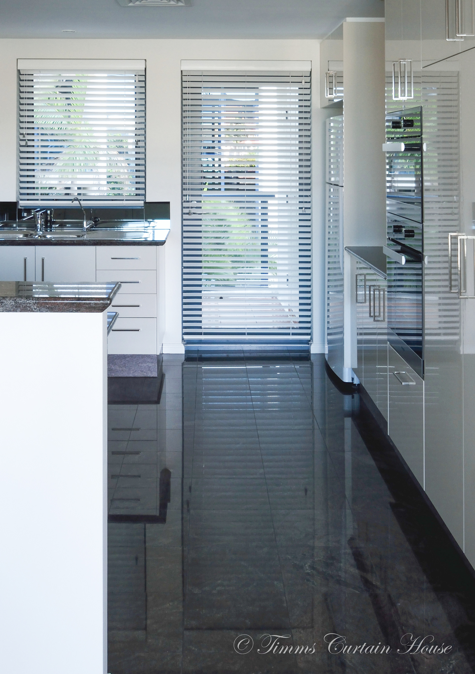 White timber venetians on door and window