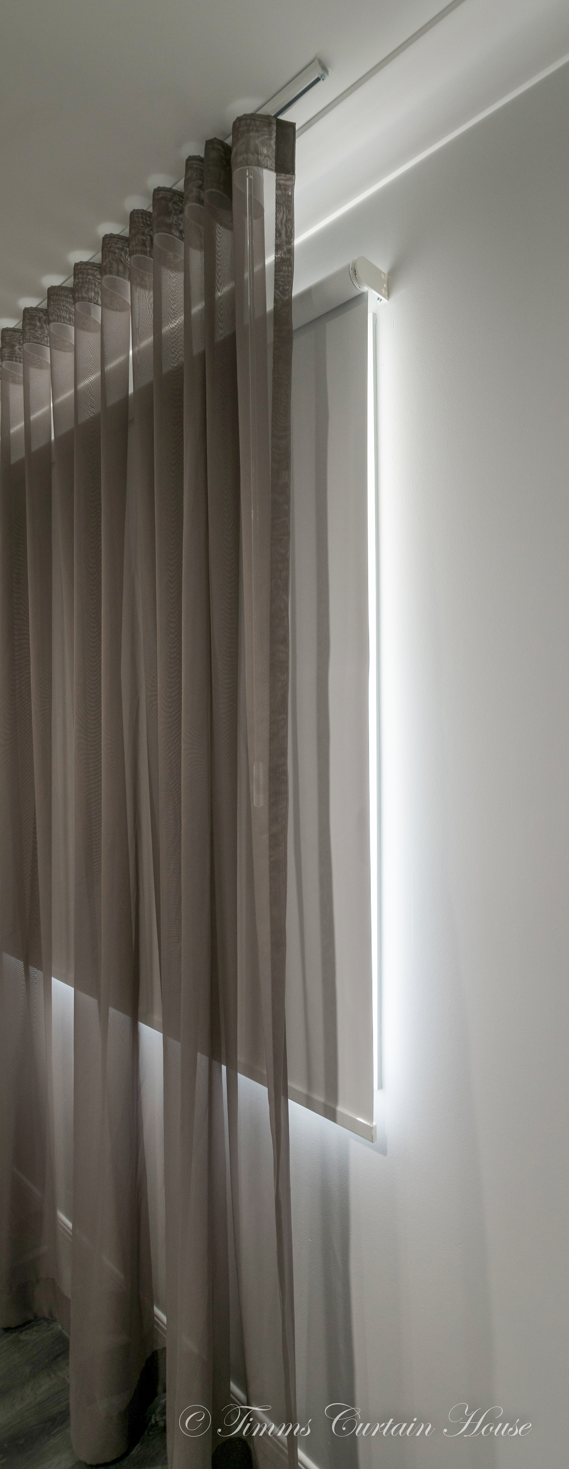 S fold sheer from ceiling track over roller blind