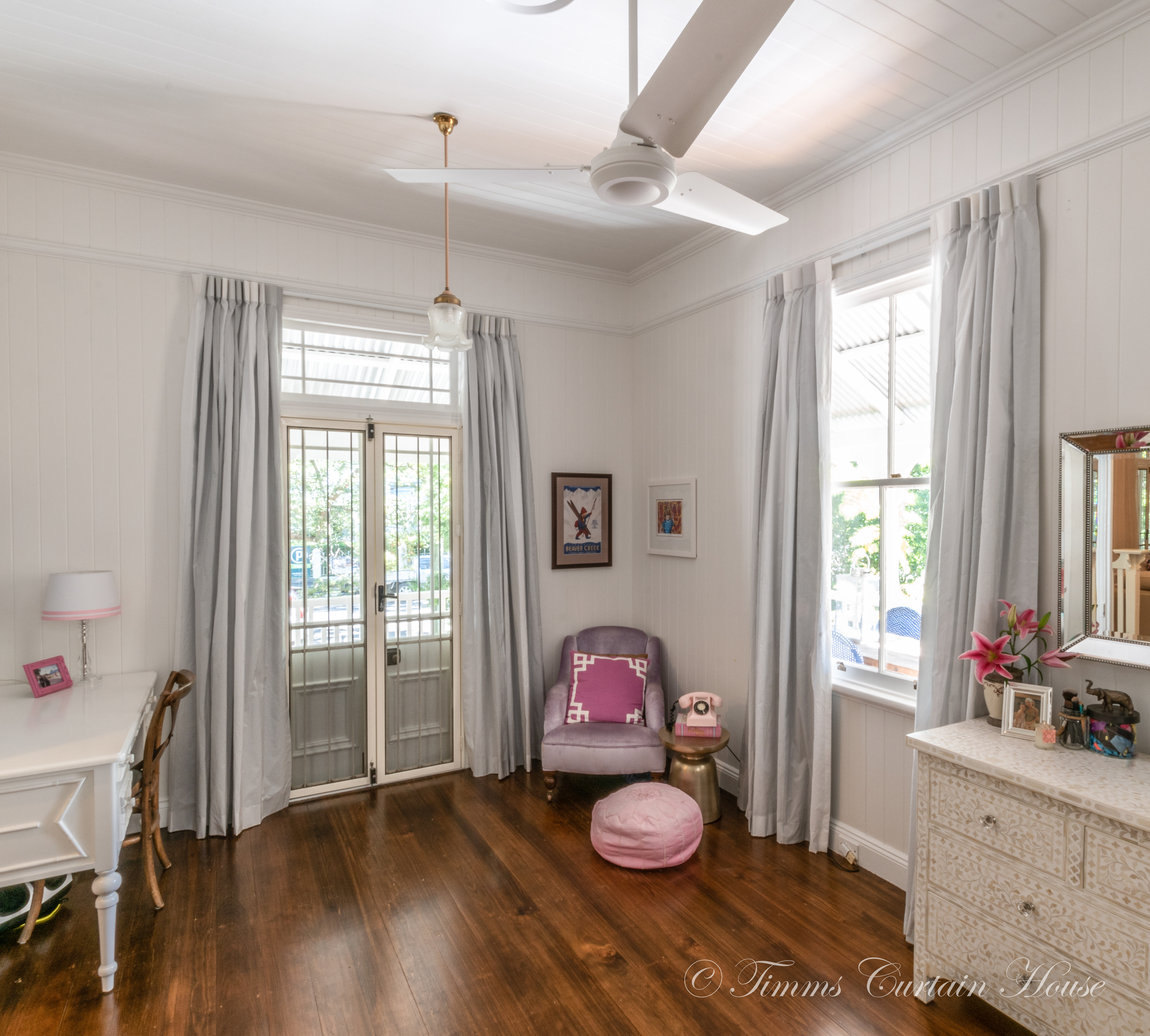 Paired curtains from below picture rail over french doors and sliding window