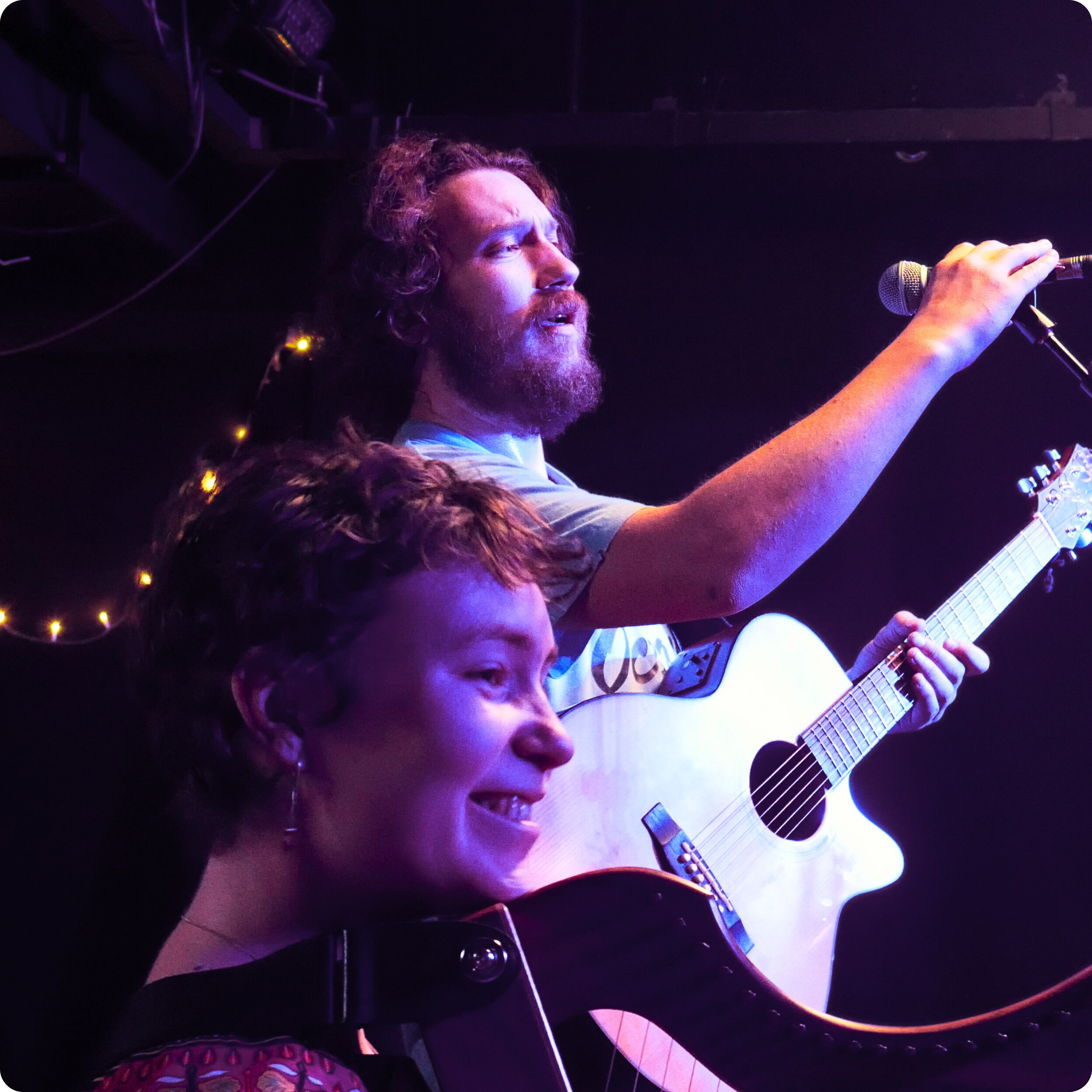 Emmy the Harp and Will the Guitar shifts songs during their set