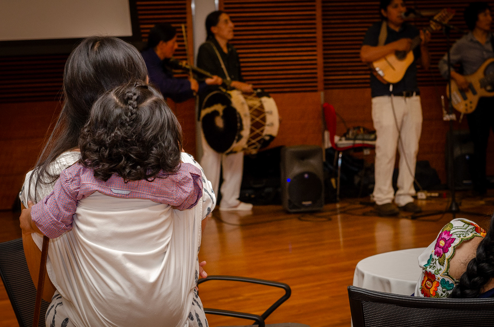 Event goers listen to the music