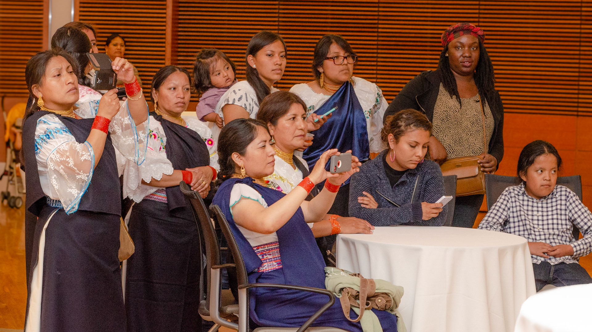 A group taking time to video the music group