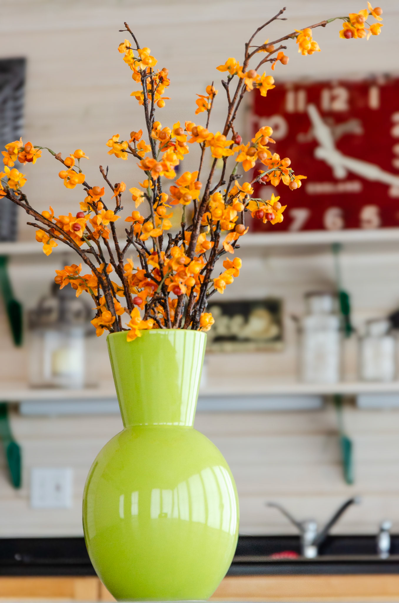 Orange harvest flowers in vase