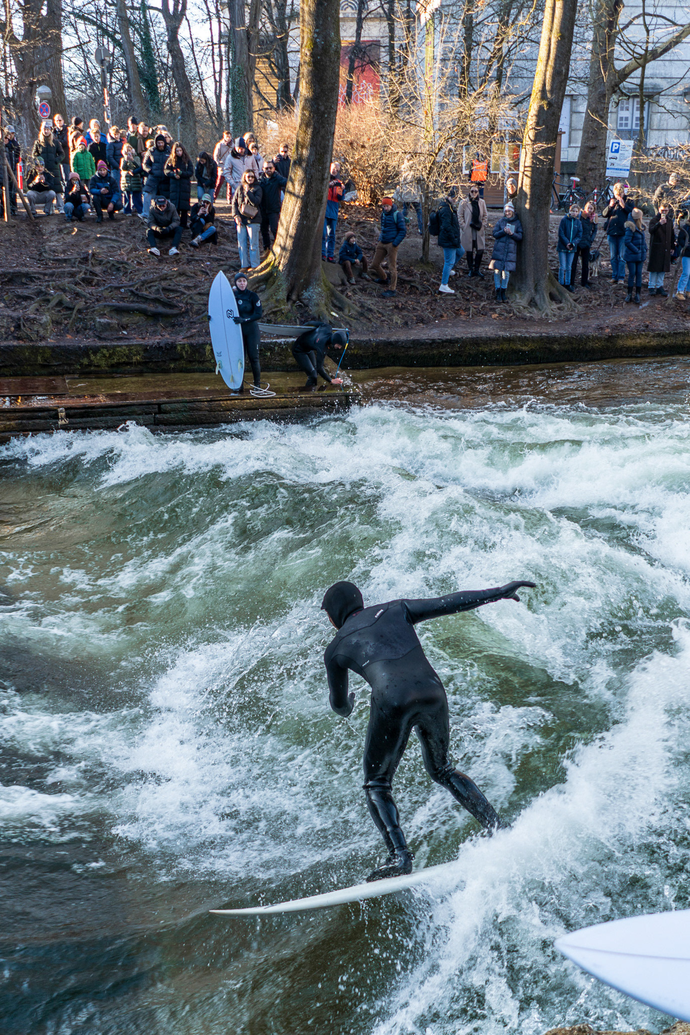 A river surfer riding a standing wave in Munich, Germany. Photograph by Alex Galmeanu.