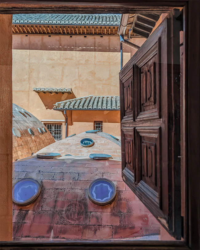 Spanish Window - A natural frame reveals the full character of the place: layered patterns, warm colors, and a quiet symmetry. The circular windows look back, turning the act of observation into a shared gaze.  ($65)