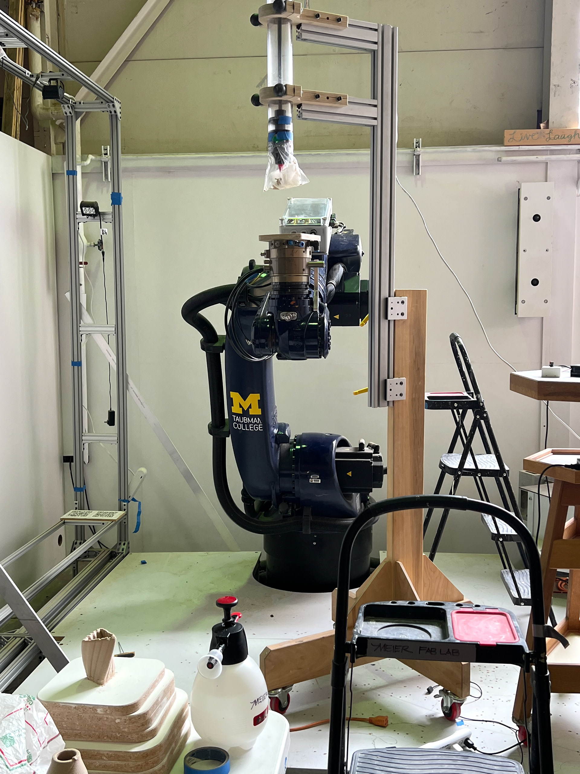 An image showcasing the robot setup for clay extrusion.