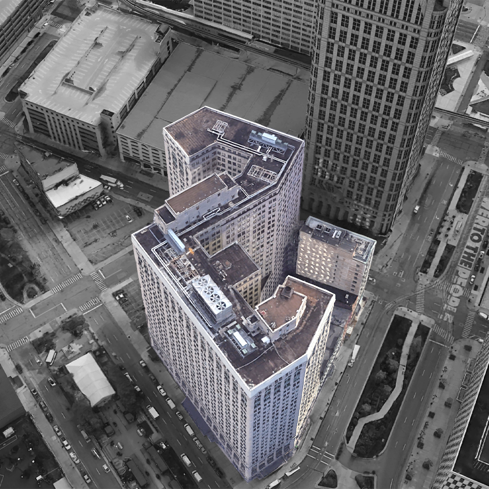 This aerial shot shows the buildings’ positioning between Bates St. (left) and Woodward Avenue (right), with Cadillac Square sandwiched between the pair. The accentuated building is primarily a commercial office building containing retail shops situated on the first floor. The building stands at a height of 347.25 ft., with 26 above ground floors and two below ground floors. This made the building Detroit’s tallest skyscraper at the time of its construction—providing a glaring display of Neoclassical architecture.