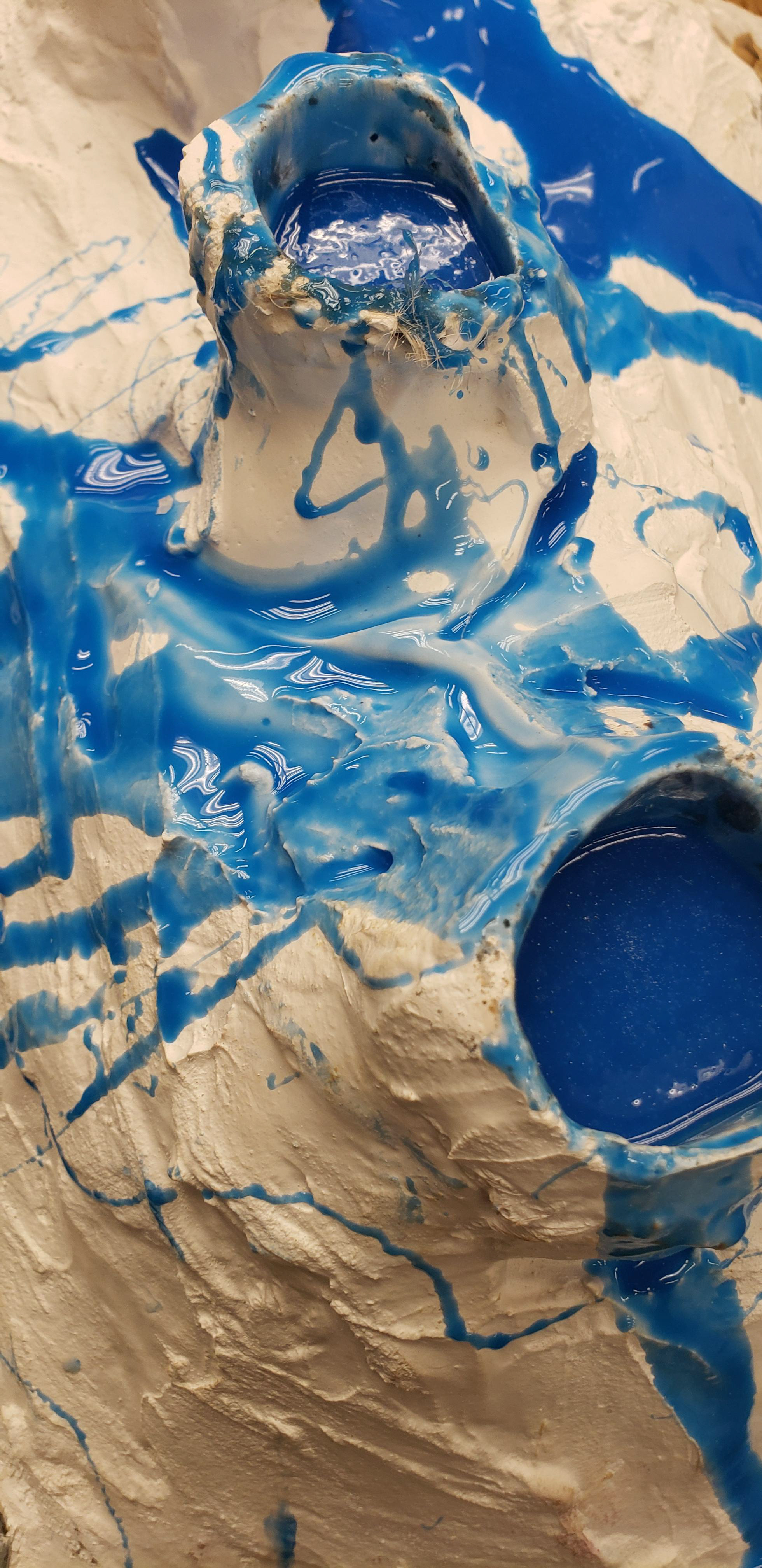 A closer view of the filled mold through the bore holes.
