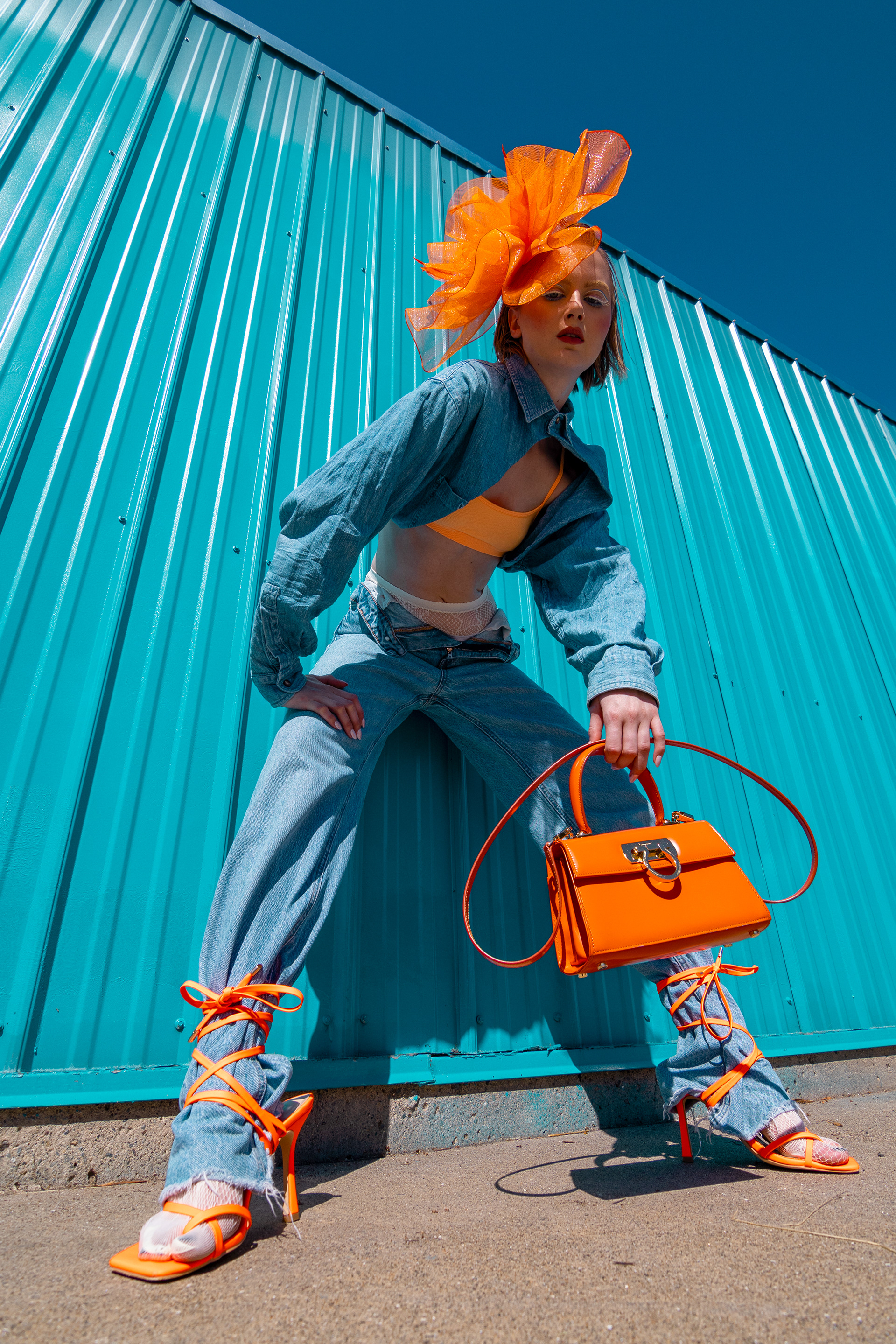 Recycled denim shirt: Urban Outfitters, orange crop top: Urban Outfitters, Jeans: Zara, Tights: Urban Outfitters, Handbag: Ferragamo, Shoes: Stylist's Own, Flower headband: stylist's own