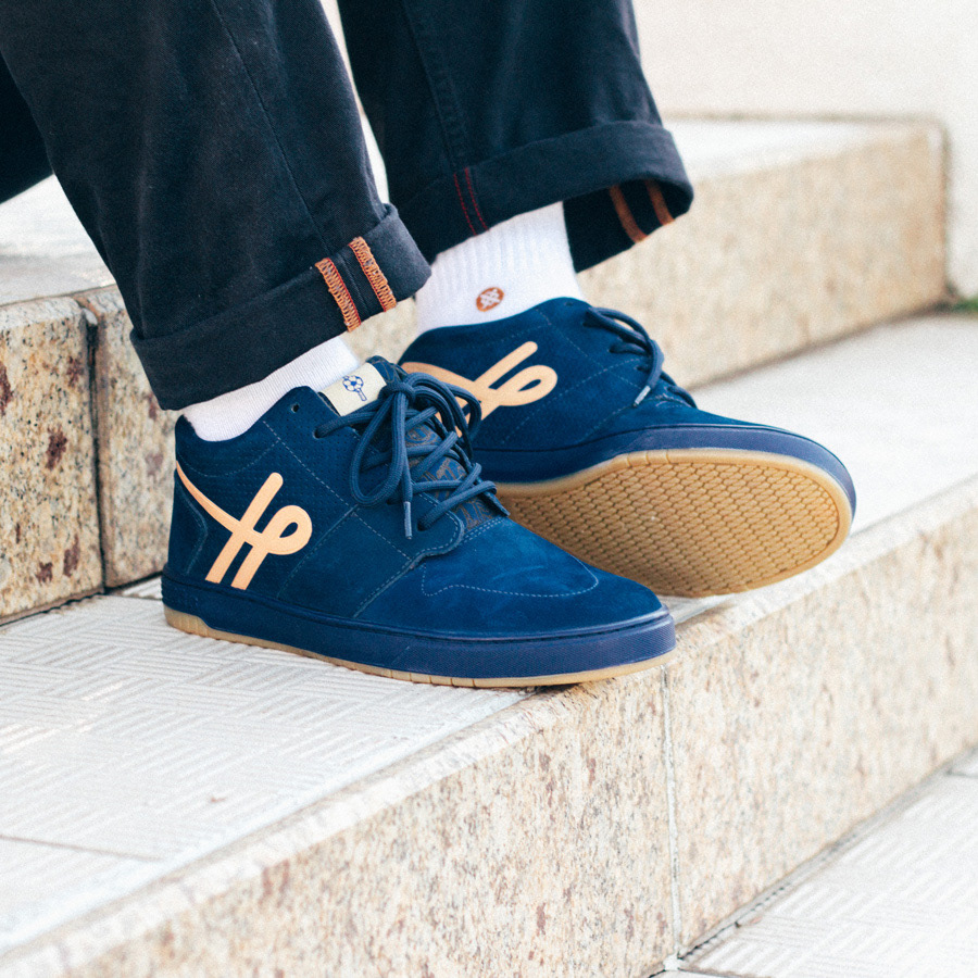 Person wearing Ous x Ninhol sneakers