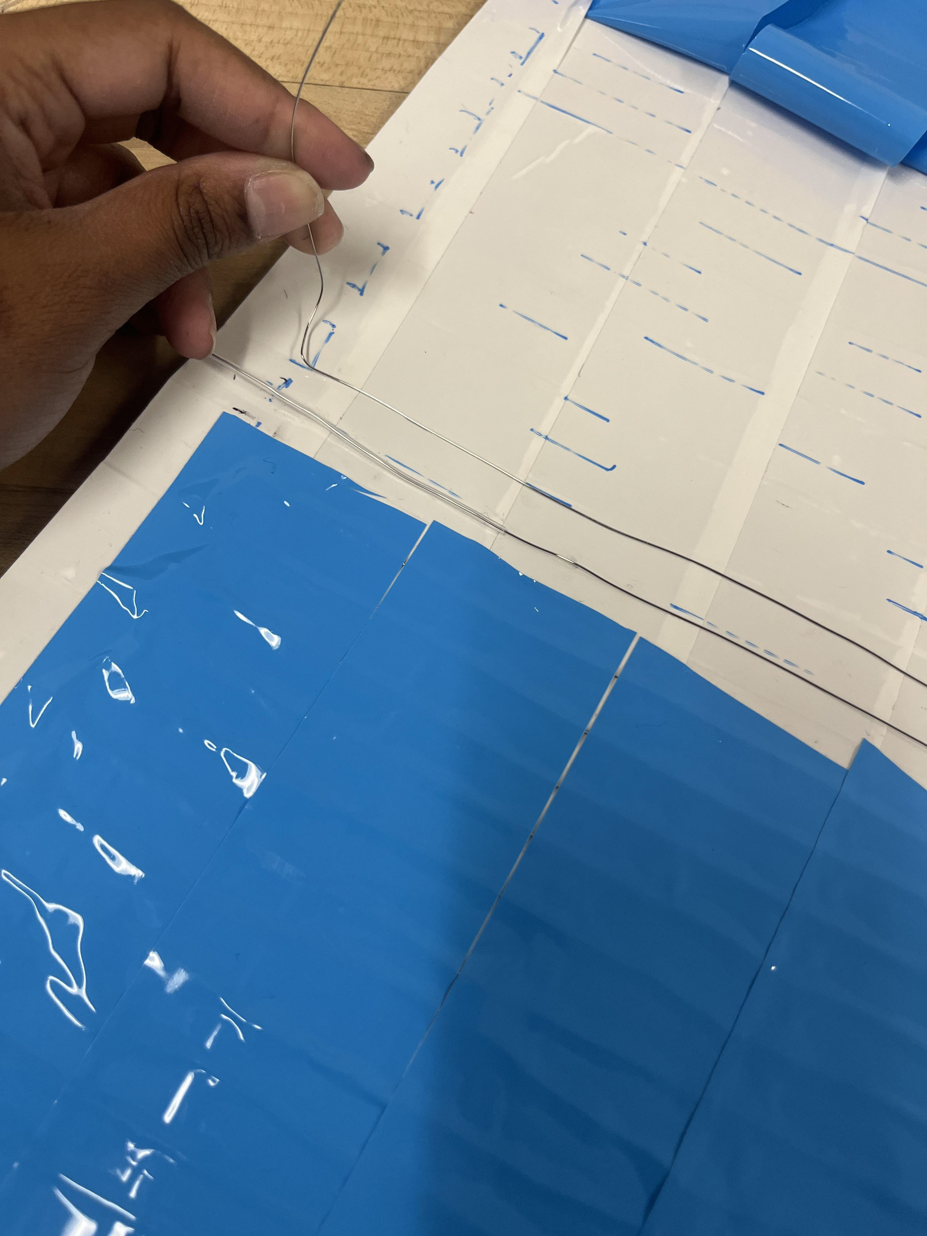 Lining Aluminum panels with nichrome wire which will heat the SHPF sheets