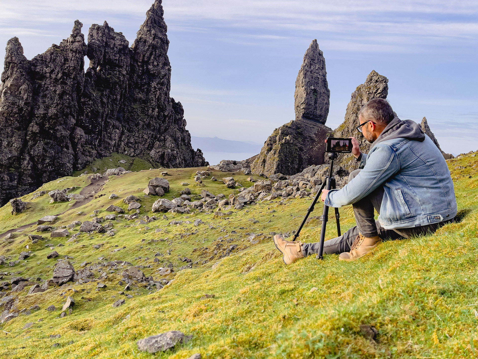 Filming after climbing The Storr at dawn, Isle of Skye, north-west Scotland