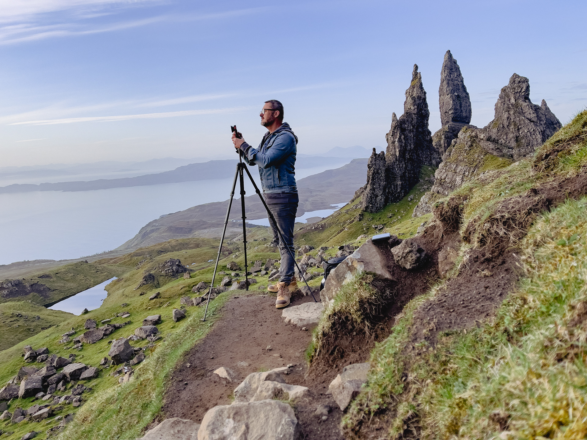 Filming after climbing The Storr at dawn, Isle of Skye, north-west Scotland
