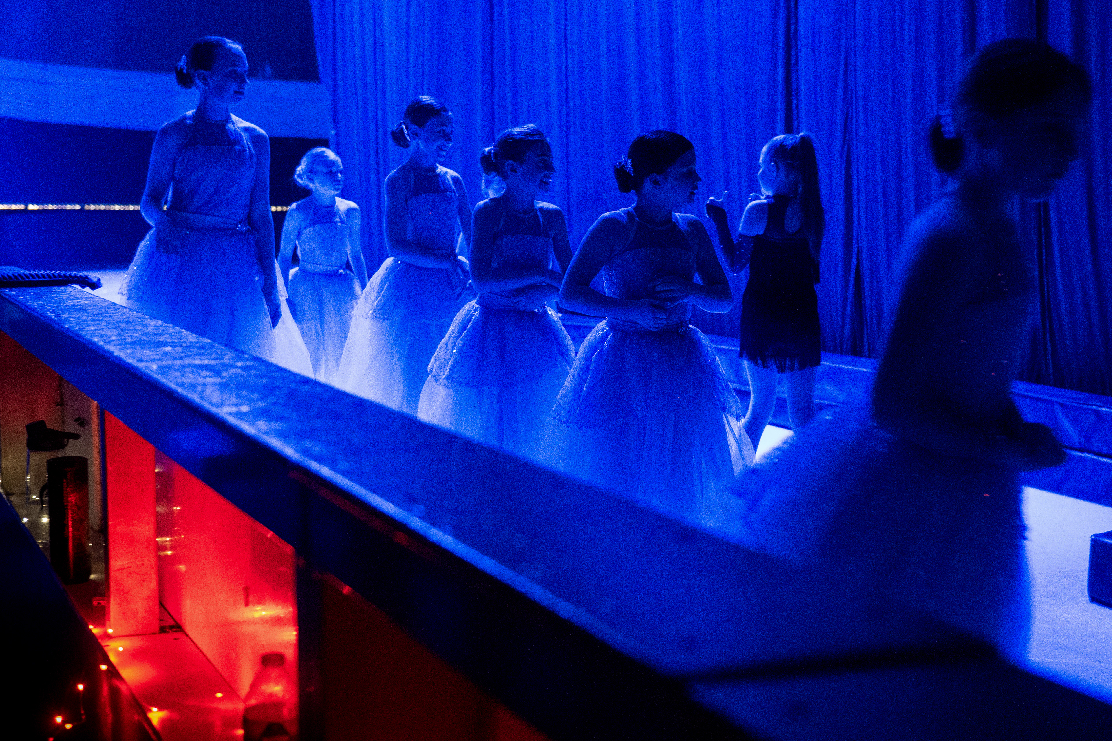 Skaters wait to go on “stage” during a performance of Wicked on Ice at Lakeland Arena in Waterford, Michigan, on Sunday, March 17, 2025.