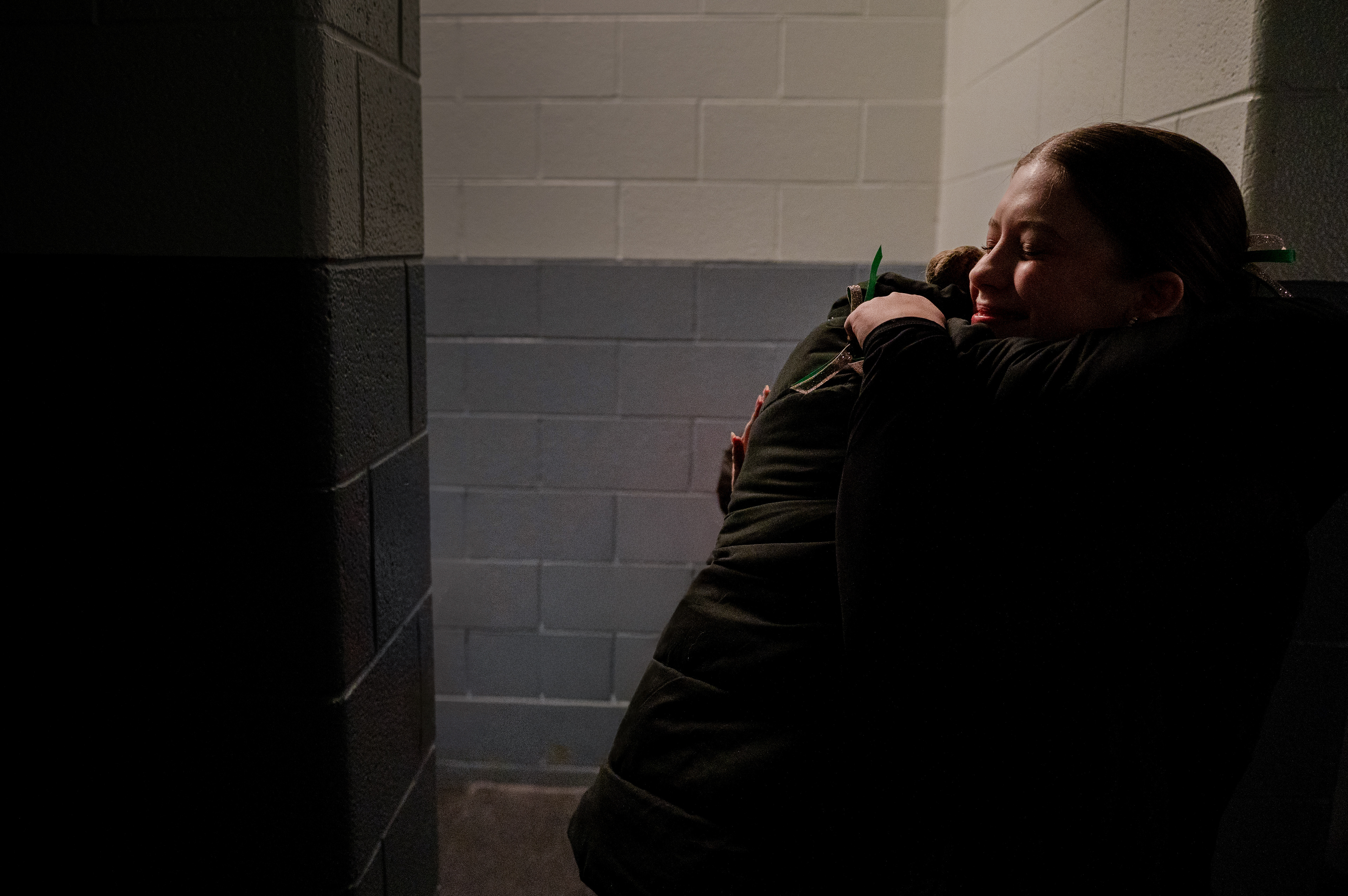 West Bloomfield figure skaters Lola Morse, 16, and Emma Waibel, 17, embrace through tears in the locker room during senior night at the Dearborn Ice Skating Center in Dearborn, Michigan, on Sunday, Feb. 4, 2025. The competition marked their first together following the crash of American Airlines Flight 5342 in Washington, D.C., on Jan. 29, 2025, which killed all 67 people aboard, including 14 members of the U.S. Figure Skating Team. The tragedy deeply shook the national skating community and brought skaters, families, and fans closer than ever in mourning and solidarity.