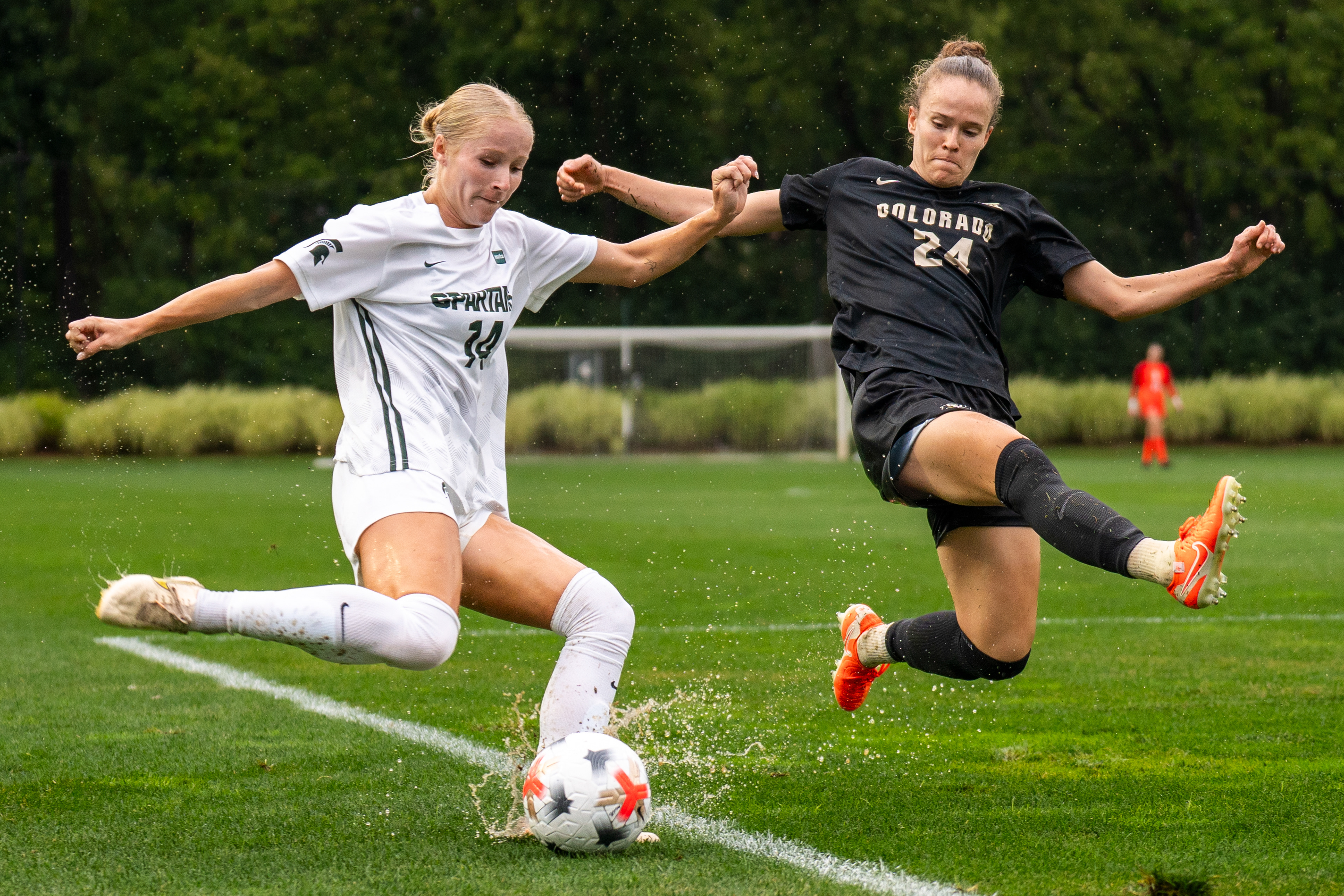 Michigan State junior defender Faith George (14) battles Colorado sophomore defender Lilian Zamorano (24) for possession during the Spartans’ 3-2 win over the Buffaloes at DeMartin Stadium in East Lansing, Mich., on Sunday, Aug. 30, 2026.