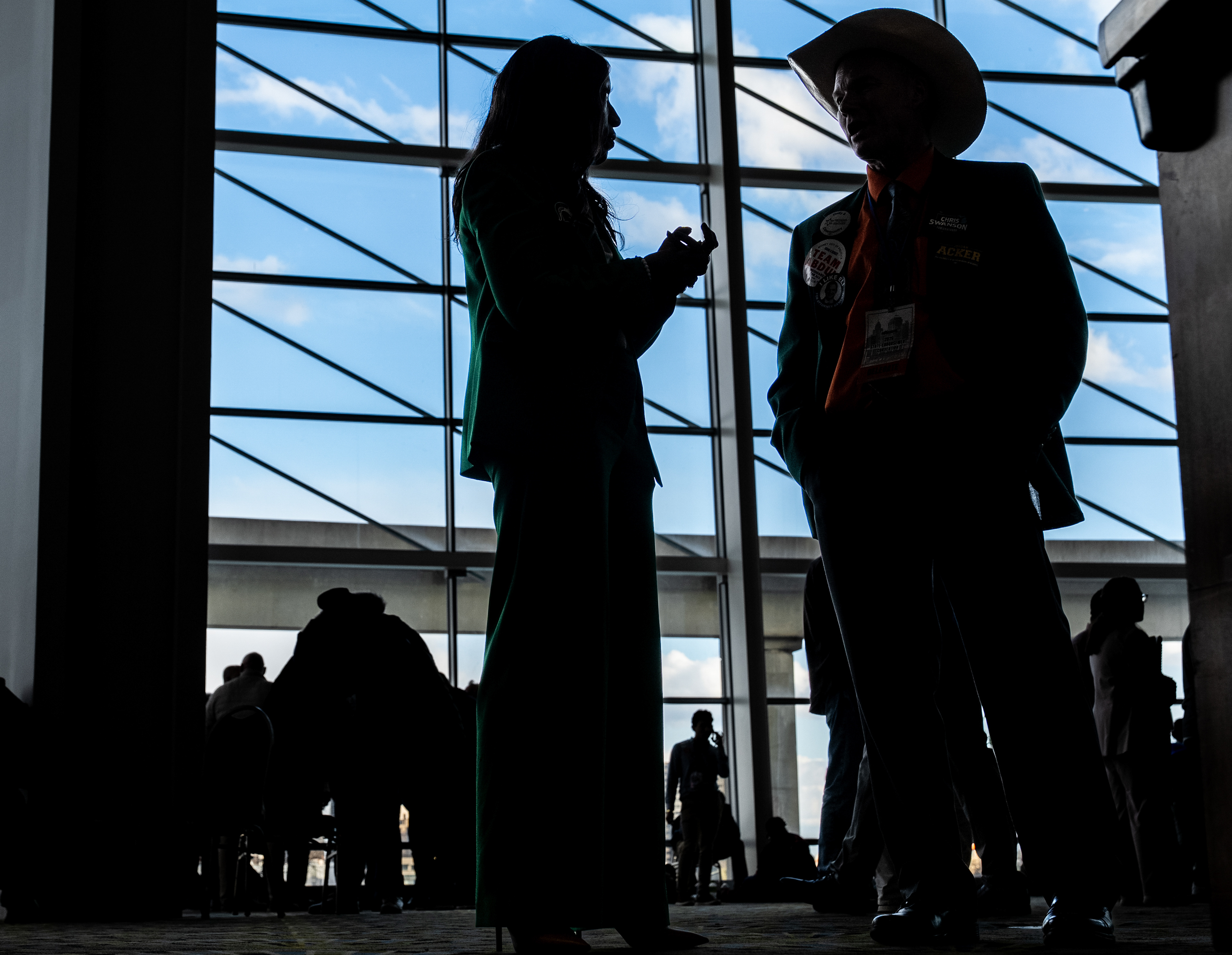 Michigan State University trustee Brianna T. Scott speaks with Mark Ludwig, 59, of Allegan County, during the Michigan Democratic State Convention at Huntington Place in Detroit on Sunday, April 19, 2026.