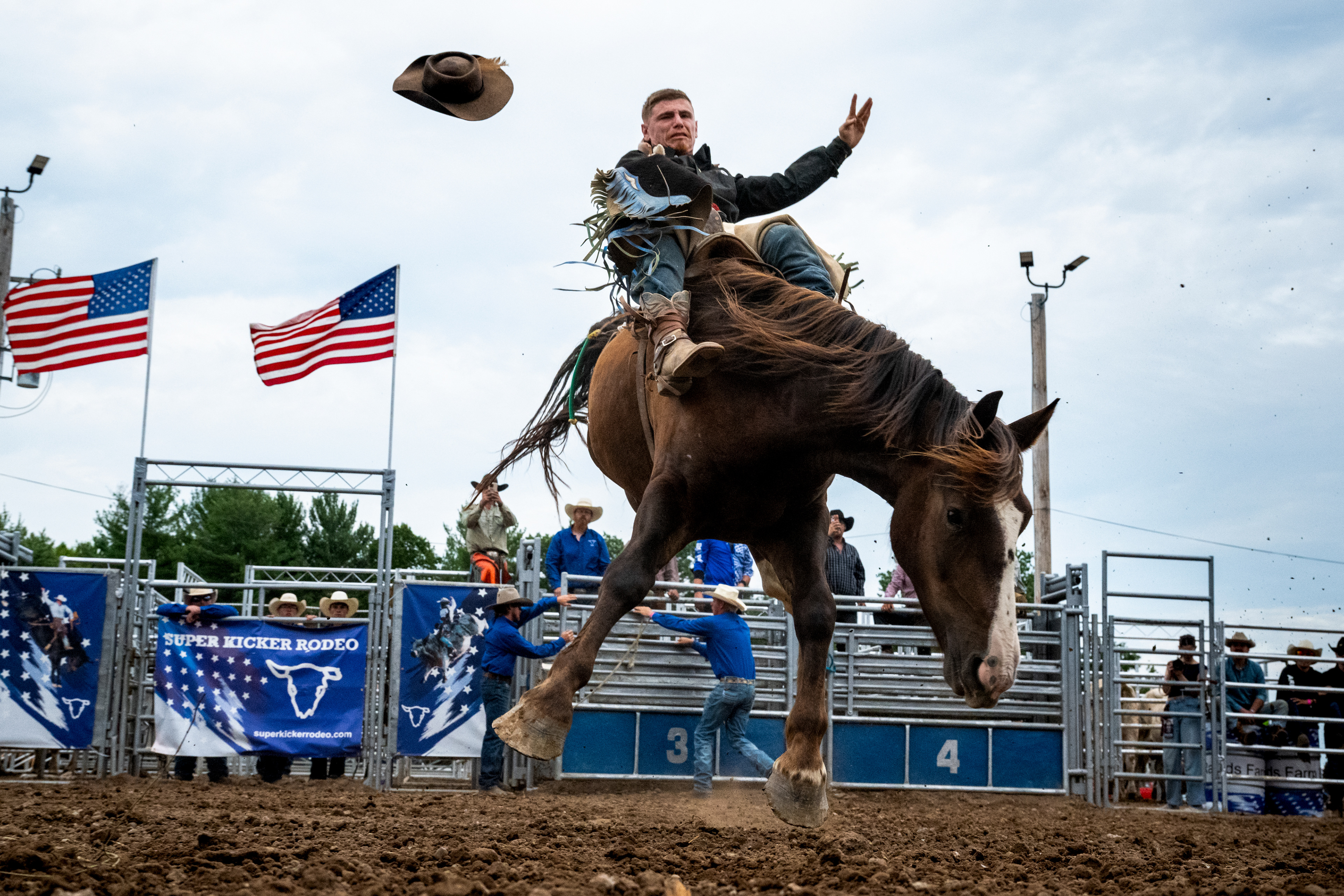 Austin Zmrzlik, 25, rides a bucking horse during the Super Kicker Rodeo on Aug. 18, 2026, in Midland, Mich.