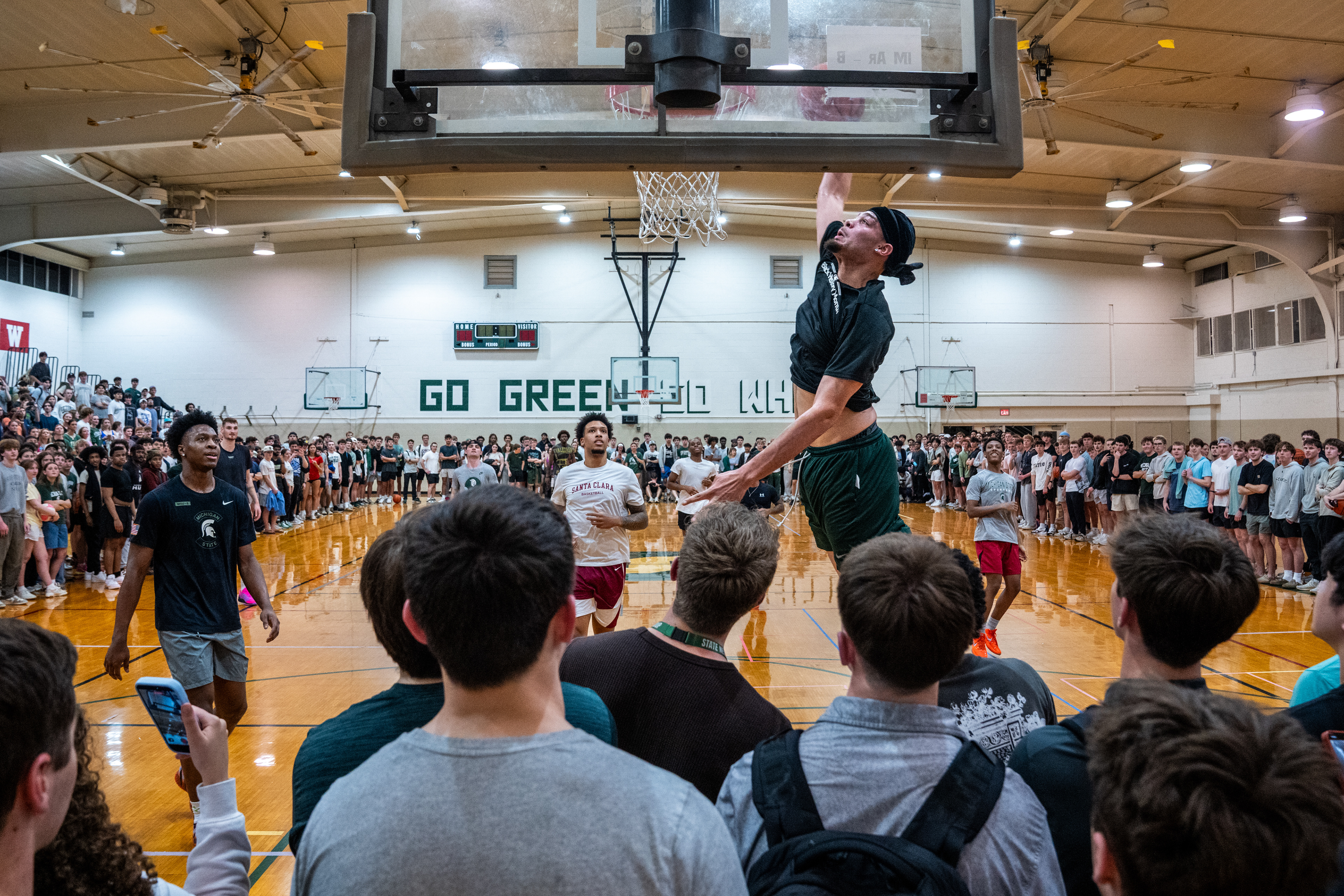 Michigan State freshman forward Jesse McCulloch dunks during pickup basketball at IM West Fitness Center on Michigan State University’s campus in East Lansing, Mich., on Tuesday, March 31, 2026.