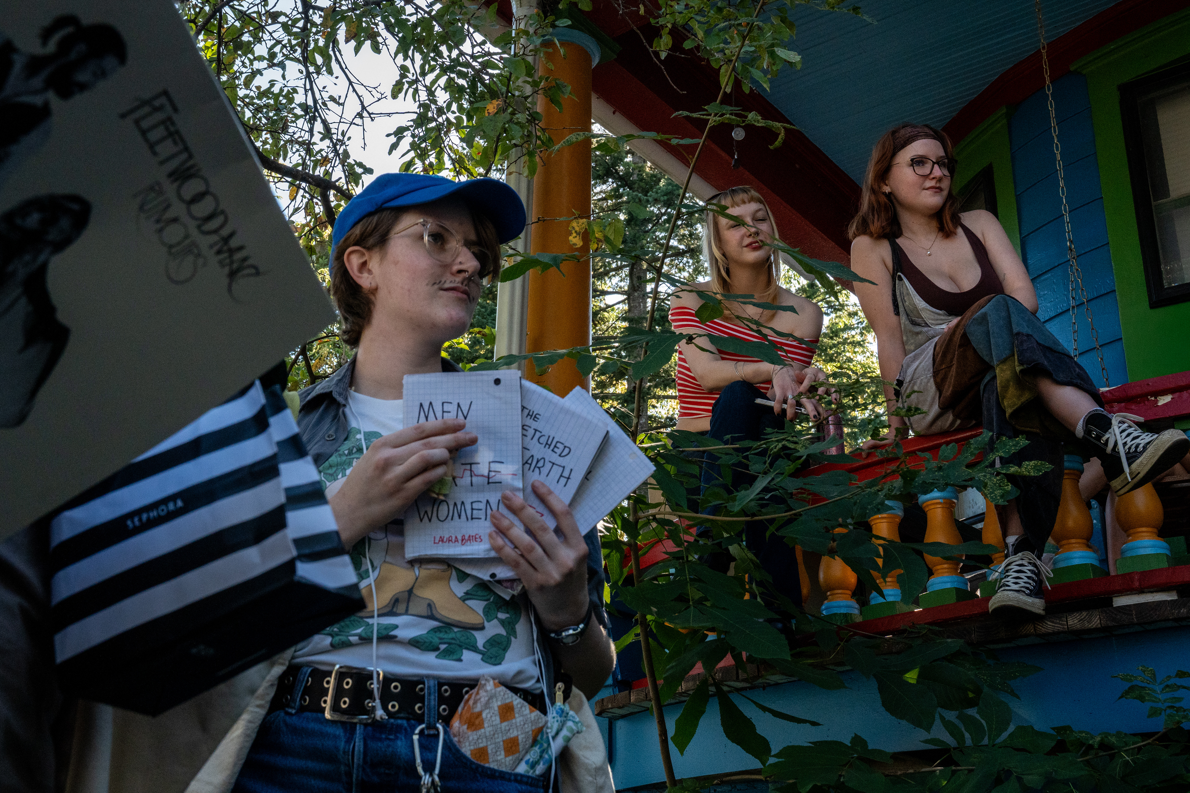 Spectators and contestants watch a "performative man" contest outside of the Howland Co-op house on M.A.C. Ave. in East Lansing, Michigan on Wednesday, September 10, 2025.