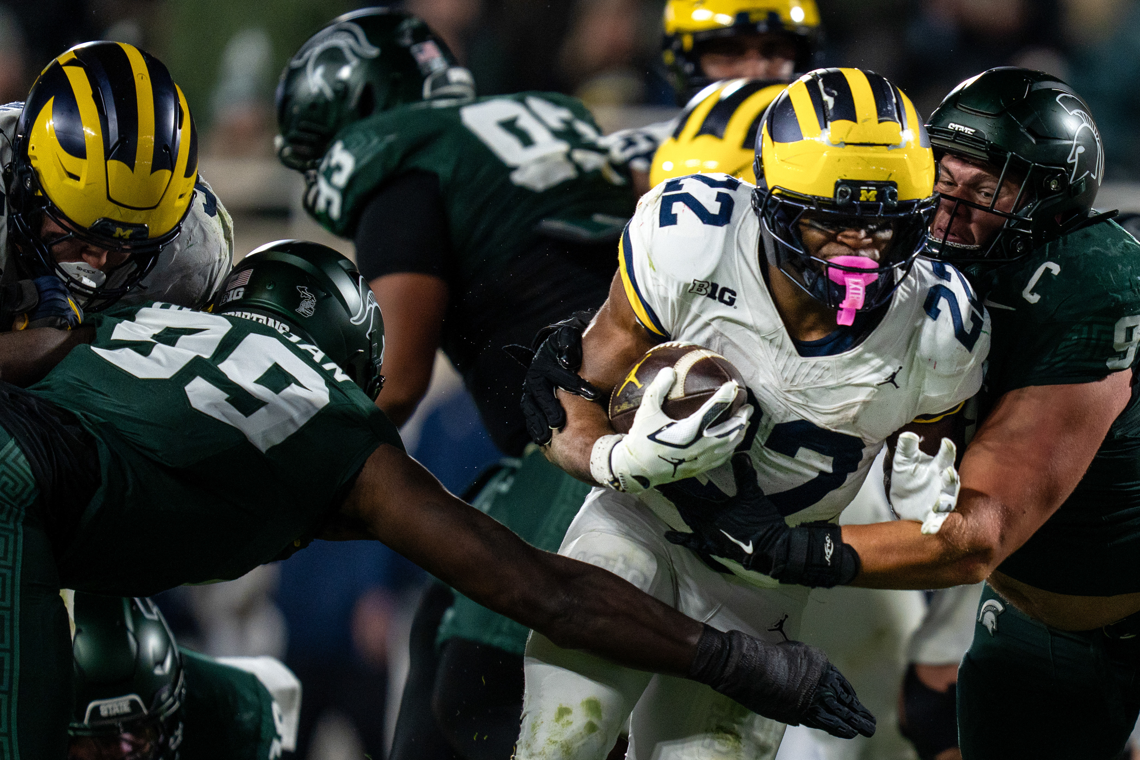Michigan running back Justice Haynes (22) drives the ball during the Michigan State University verses University of Michigan at Spartan Stadium in East Lansing, Michigan on Saturday, Oct. 25, 2025.