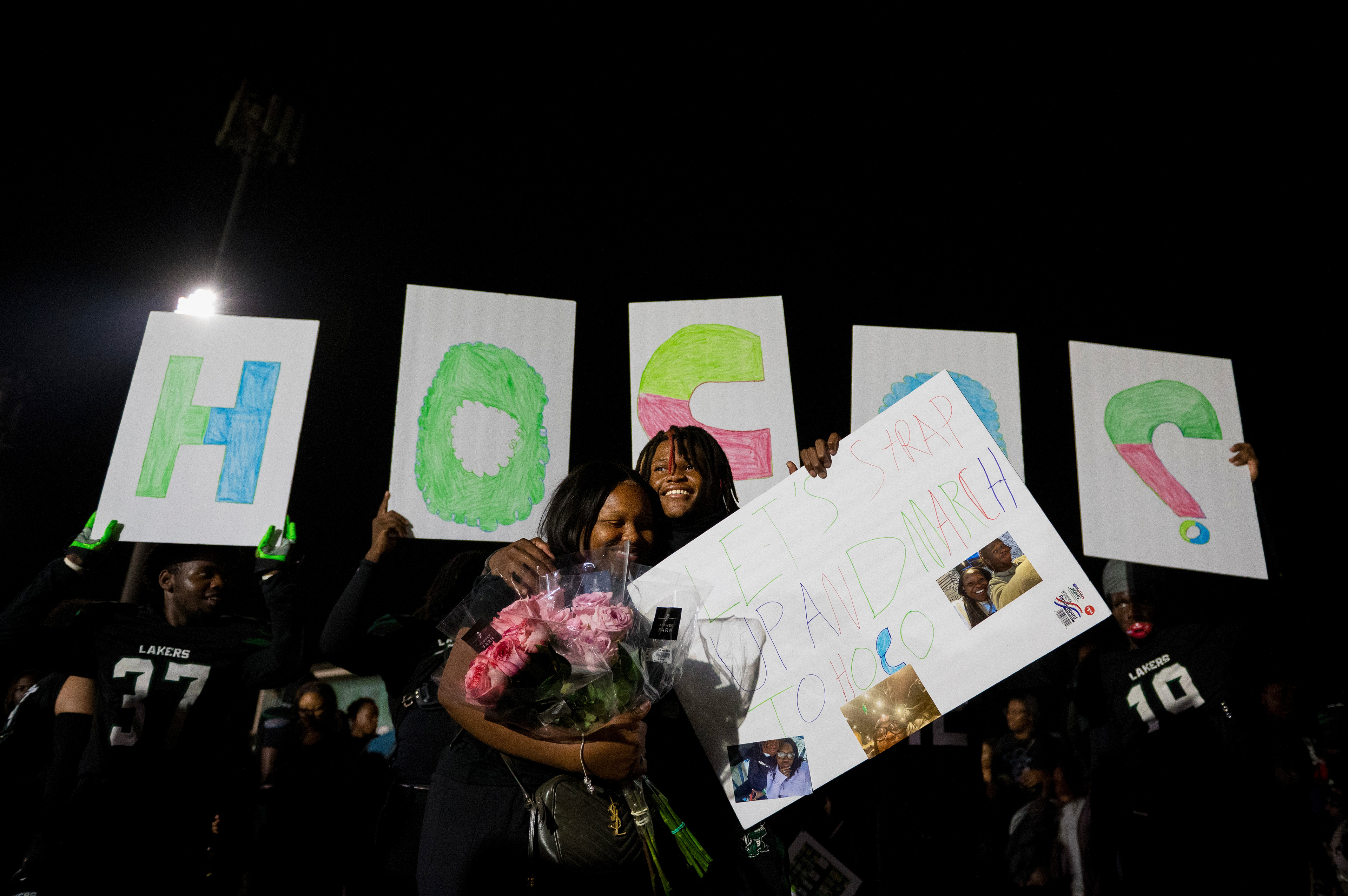Junior defensive back Kaliq Robinson (21) of West Bloomfield High School asks Kyelle Smith, a junior at Southfield A&T, to the homecoming dance following the Lakers’ homecoming game against Southfield A&T at West Bloomfield High School in West Bloomfield, Mich., on Friday, Sept. 20, 2024. Teammates helped plan the proposal. “Having my teammates involved made it even more special,” Robinson said. “This is a moment I’ll remember for the rest of my life.”