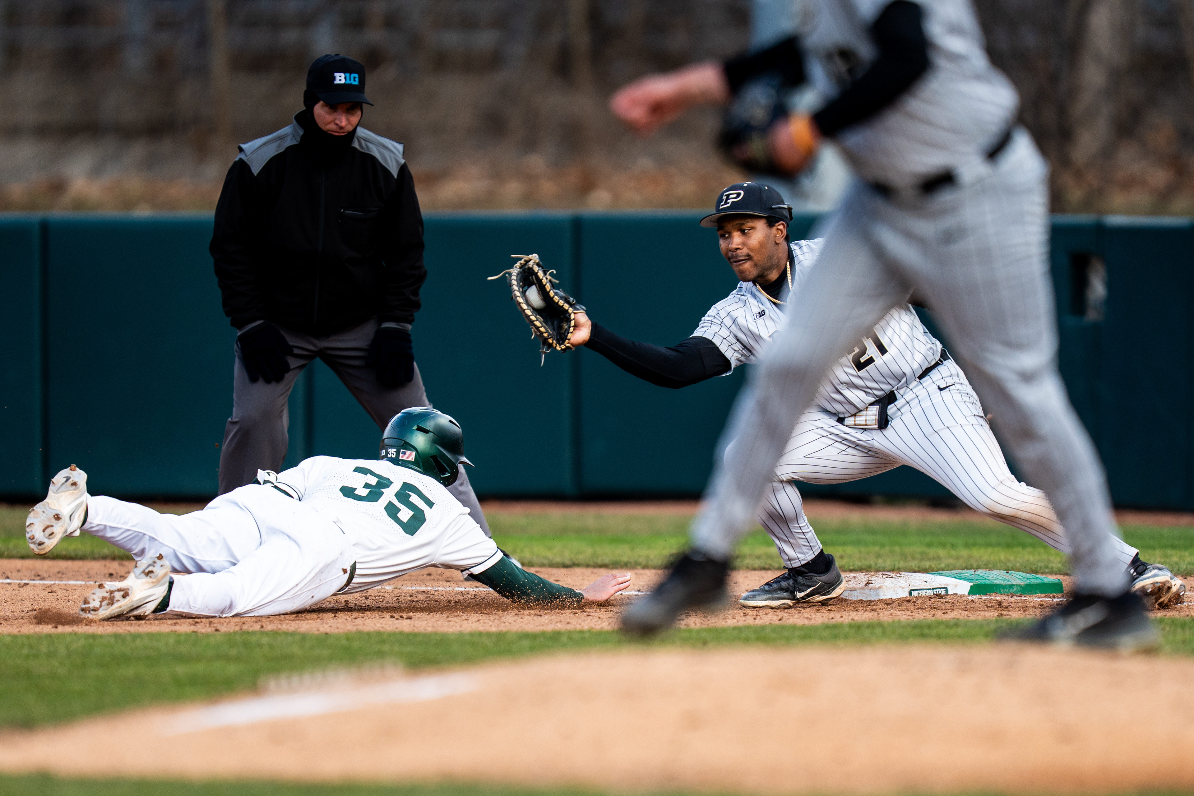 Michigan State infielder Randy Seymour (35) dives for first base during a baseball game against Purdue on Michigan State University’s campus in East Lansing, Mich., on Friday, March 27, 2026.