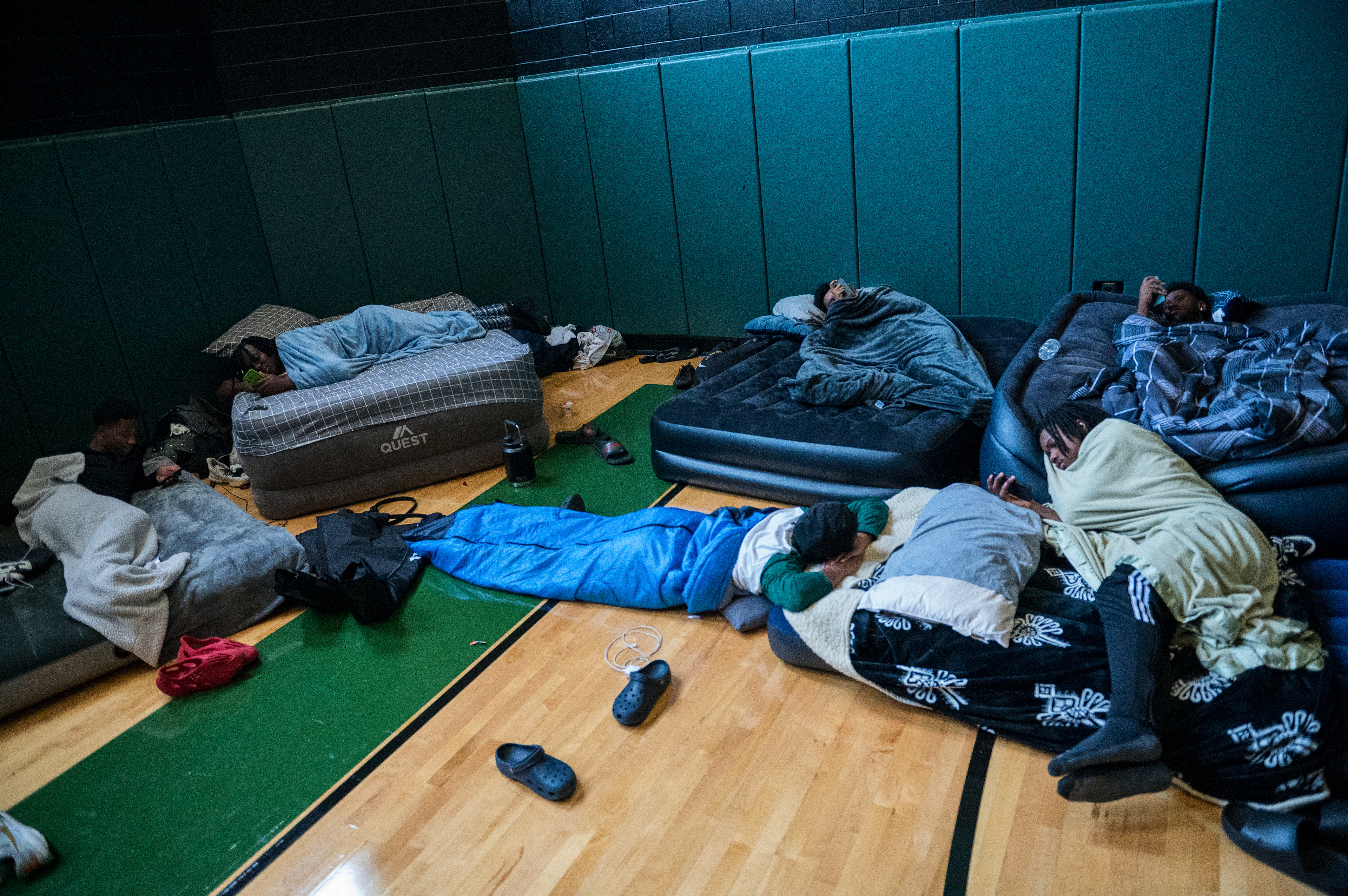 West Bloomfield High School football players rest between practices during football camp at West Bloomfield High School in West Bloomfield, Mich. “I’m done with this s***,” senior offensive lineman Dwayne Broome said.
