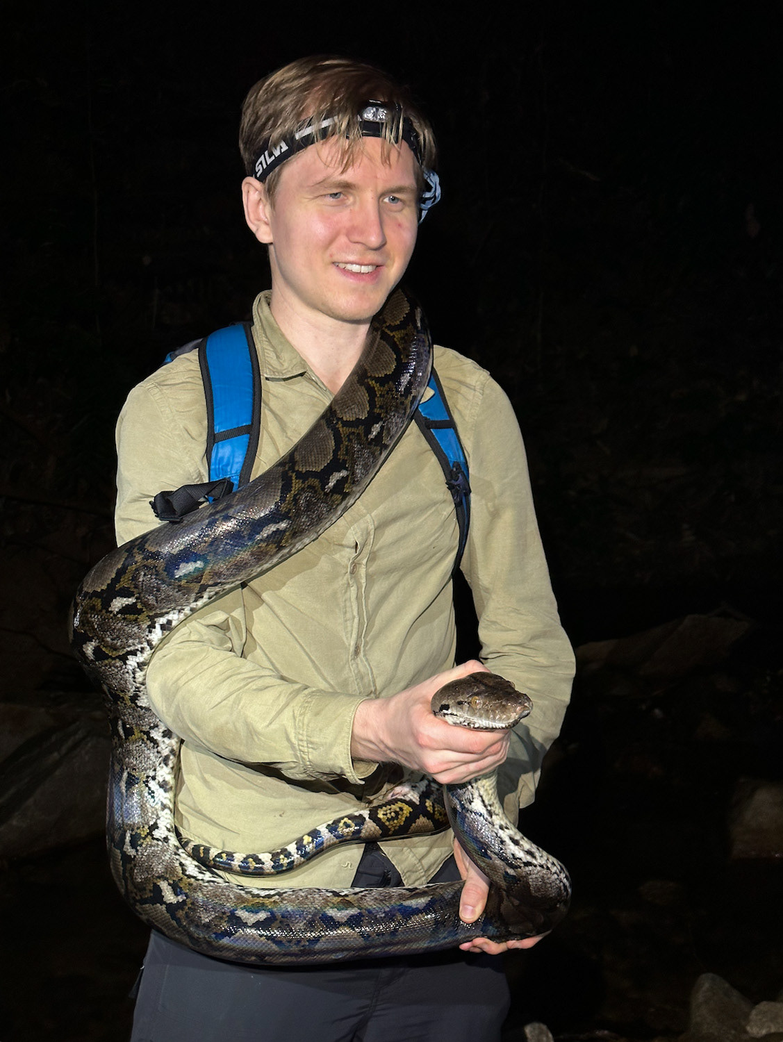 Freddie holding the large reticulated python.