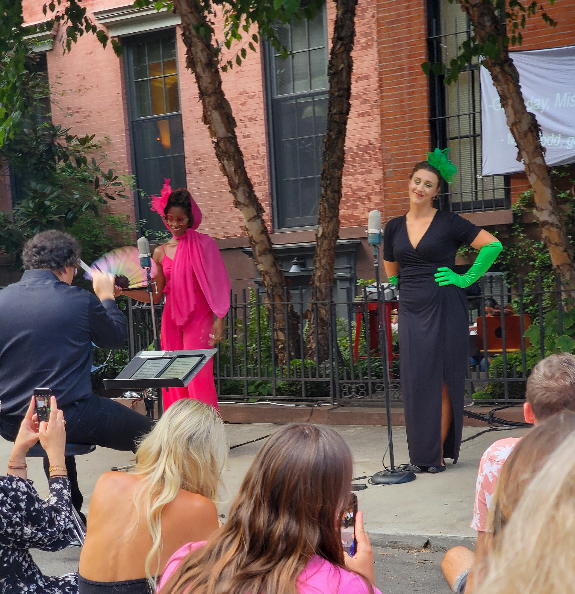 Miss Pinkerton comes to call on Miss Todd. The audience whips out cameras (unscripted).