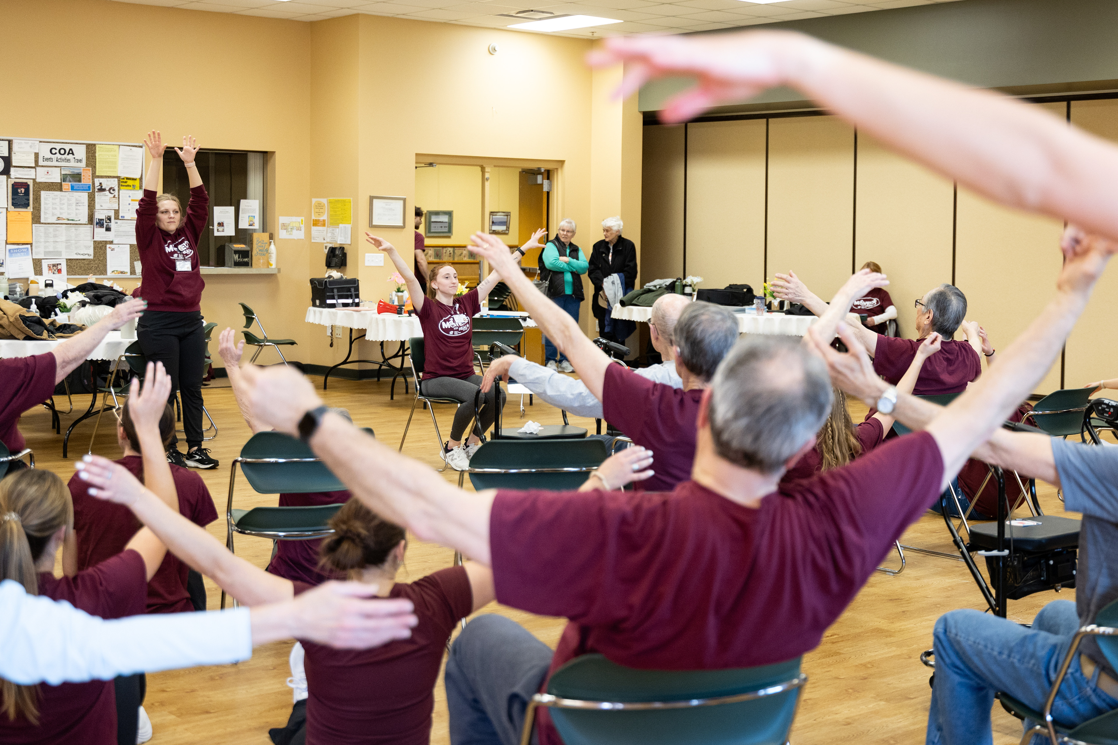 Central Michigan University second-year physical therapy doctoral student Alexis Pultorak leads the MOVE! For Health class in a cool-down at the Commission on Aging, 2200 S. Lincoln Rd., Mount Pleasant, Michigan, Thursday, March 20, 2025.