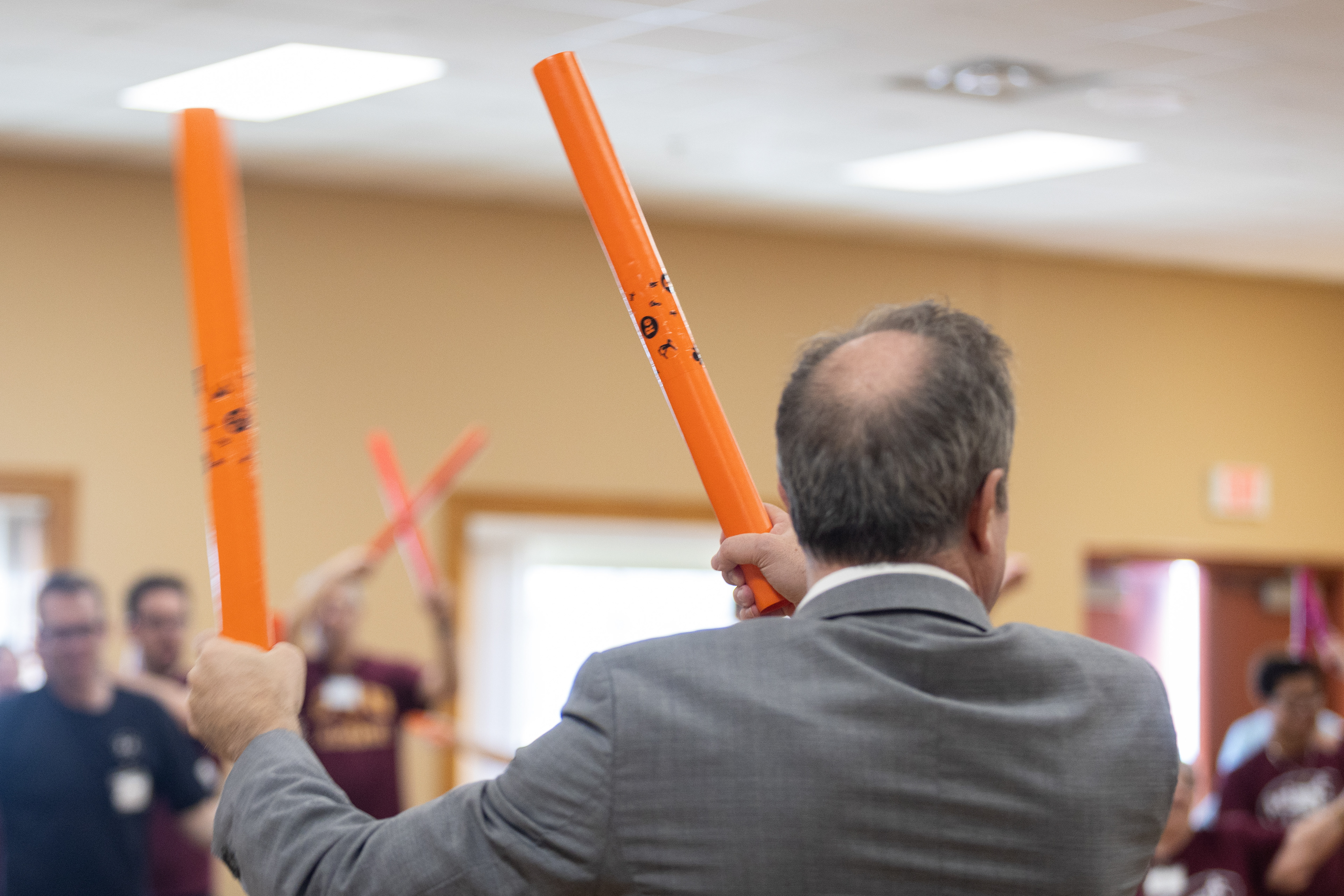 Central Michigan University 16th President, Neil MacKinnon, joins along with the warm-up during the MOVE! For Health class at the Commission on Aging, 2200 S. Lincoln Rd., Mount Pleasant, Michigan, Thursday, March 20, 2025.